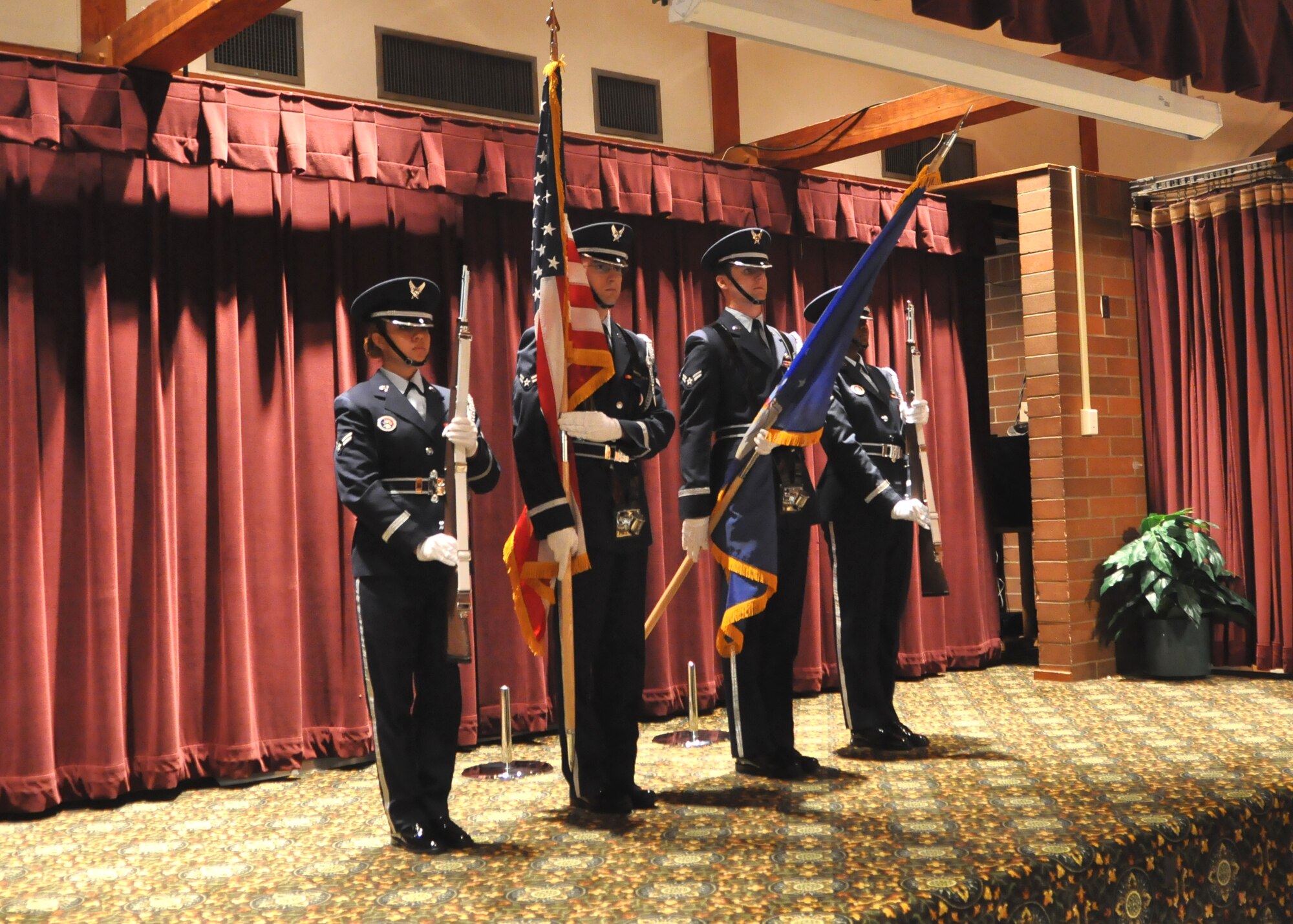 Honor Guard Airmen post the colors to officially start the Prisoner of War/Missing in Action Recognition Day luncheon at the McChord Field Club Sept. 16, 2011, at Joint Base Lewis-McChord, Wash. Each year, the third Friday in September is set aside to honor the commitment and sacrifices by this nation’s POWs and MIAs. (U.S. Air Force photo/Airman 1st Class Leah Young)
