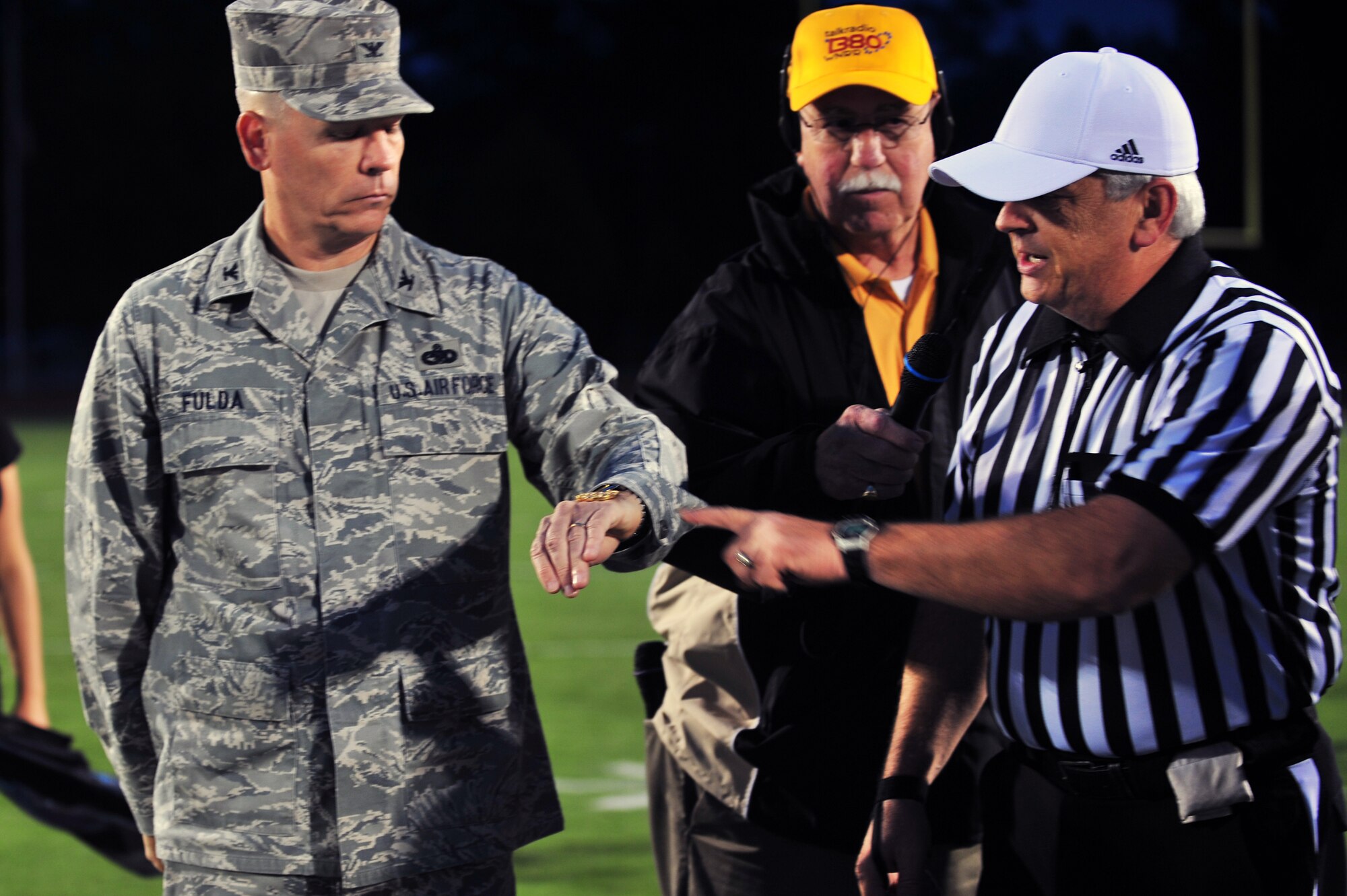 U.S. Air Force Col. Walter Fulda, 20th Mission Support Group commander participates in a coin toss held at Sumter High School's stadium in Sumter, S.C. Sept. 16, 2011. The football game was free to all military members for Military Appreciation Night. (U.S. Air Force photo by Airman 1st Class Ashley L. Gardner/ Released)
