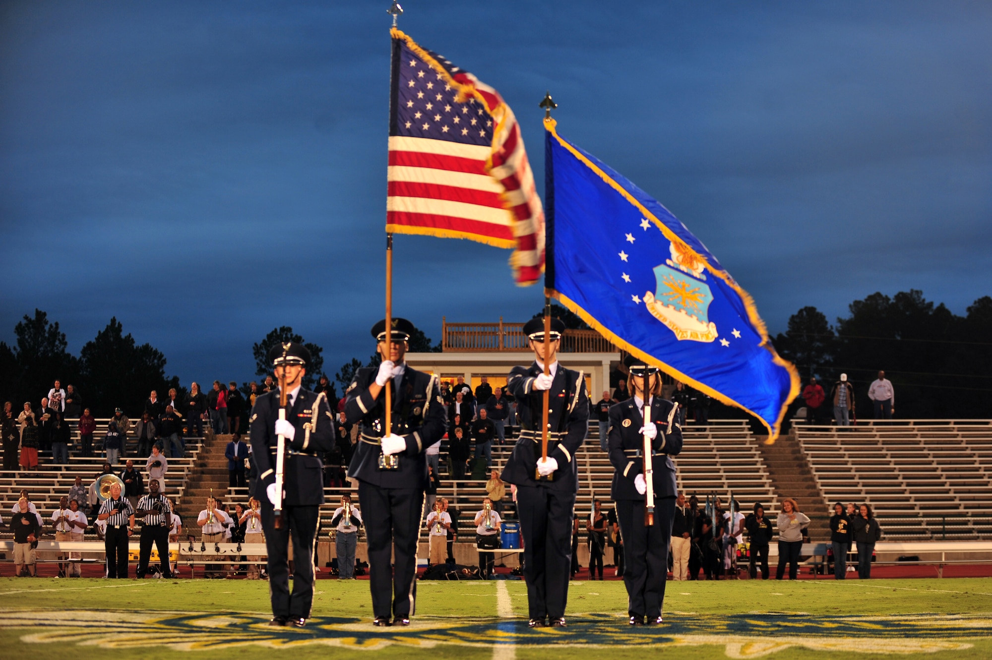 U.S. Air Force Shaw Honor Guard post the "Colors" during a football game held at Sumter High School's stadium in Sumter, S.C. Sept. 16, 2011. The football game was free to all military members for Military Appreciation Night. (U.S. Air Force photo by Airman 1st Class Ashley L. Gardner/ Released)
