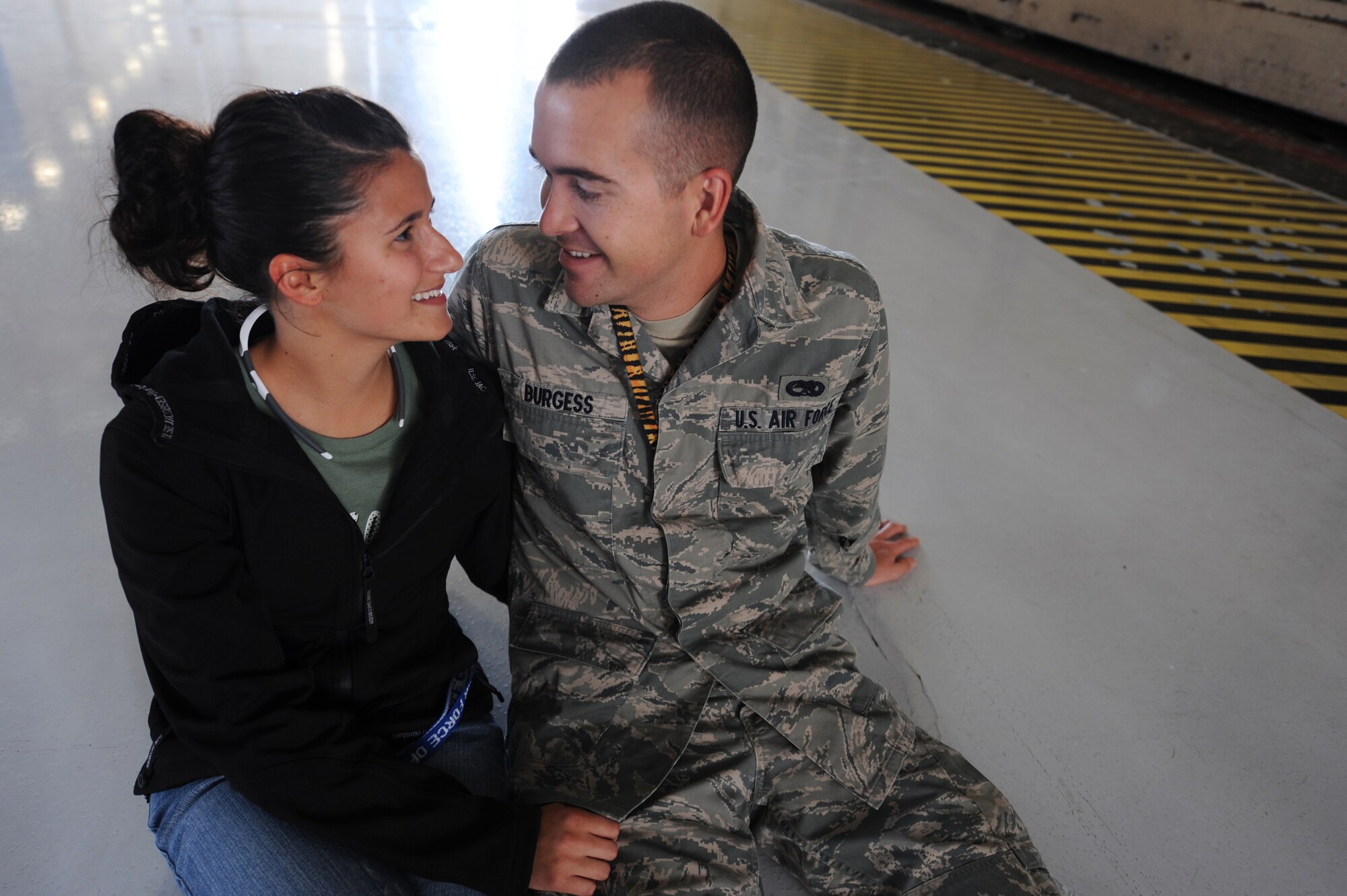 A U.S. Air Force 20th Aircraft Maintenance Squadron Airman 1st Class spends quality time with his wife before leaving for a six month deployment, Sept. 19, 2011, Shaw Air Force Base, S.C. Families and friends gathered at Shaw before the deployment to say their temporary farewells to their Airmen. (U.S. Air Force photo by Airman 1st Class Ashley L. Gardner/ Released)