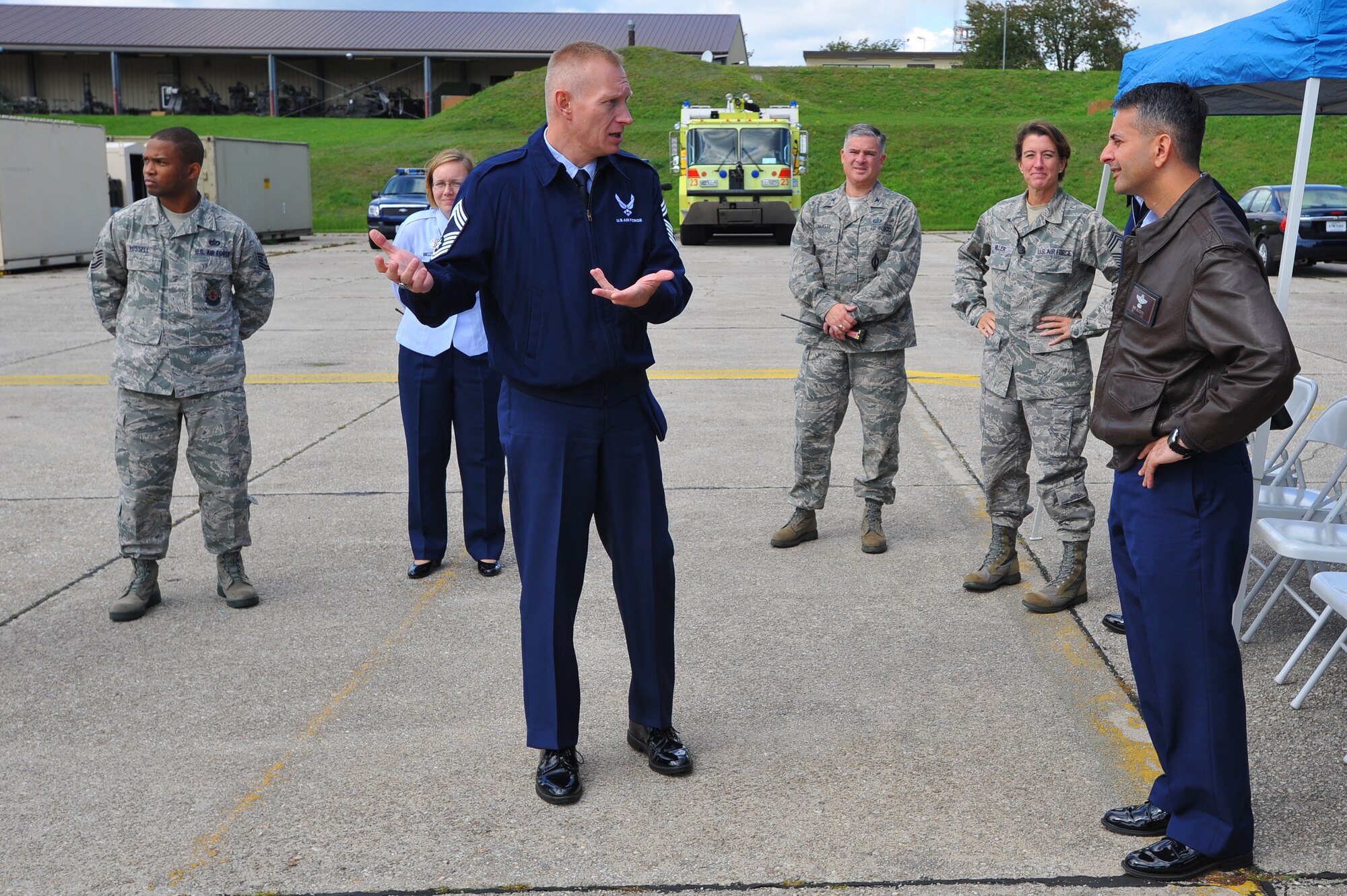 SPANGDAHLEM AIR BASE, Germany – Chief Master Sgt. Richard Lien, 52nd Civil Engineer Squadron fire chief, explains to Col. David Julazedeh, 52nd Fighter Wing vice commander, the procedures for responding to an aircraft fire here Sept. 19. The demonstration showcased the fire department’s ability to protect Airmen and assets. (U.S Air Force photo/Airman 1st Class Dillon Davis)
