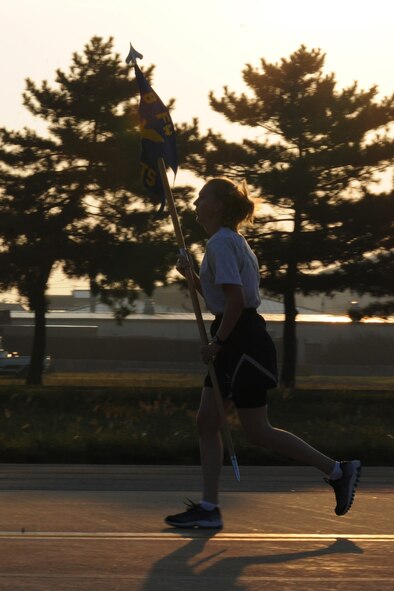 KUNSAN AIR BASE, Republic of Korea -- An Airman from the 8th Fighter Wing participates in the Warrior Run here Sept. 16. The warrior run was one event held to remember the POW/MIA servicemembers because they are never forgotten. (U.S. Air Force photo/Senior Airman Brittany Y. Bateman)