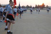 KUNSAN AIR BASE, Republic of Korea -- Members of the Wolf Pack stretch before starting the warrior run here Sept. 16. The warrior run was an event held to remember the prisoners of warrior and missing in action servicemembers because they are never forgotten.  (U.S. Air Force photo/Senior Airman Brittany Y. Bateman)