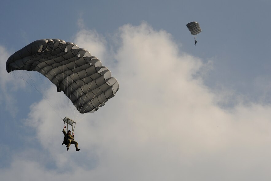 CHEONGJU, Republic of Korea -- A U.S. Air Force survival, evasion, resistance and escape instructor slowly falls toward the drop zone here Sept. 15. The U.S. Air Force and Republic of Korea Air Force performed a jump together helping improve relationships with one another and stimulate a continued bilateral partnership on the peninsula. (U.S. Air Force photo/Staff Sgt. Rasheen A. Douglas)