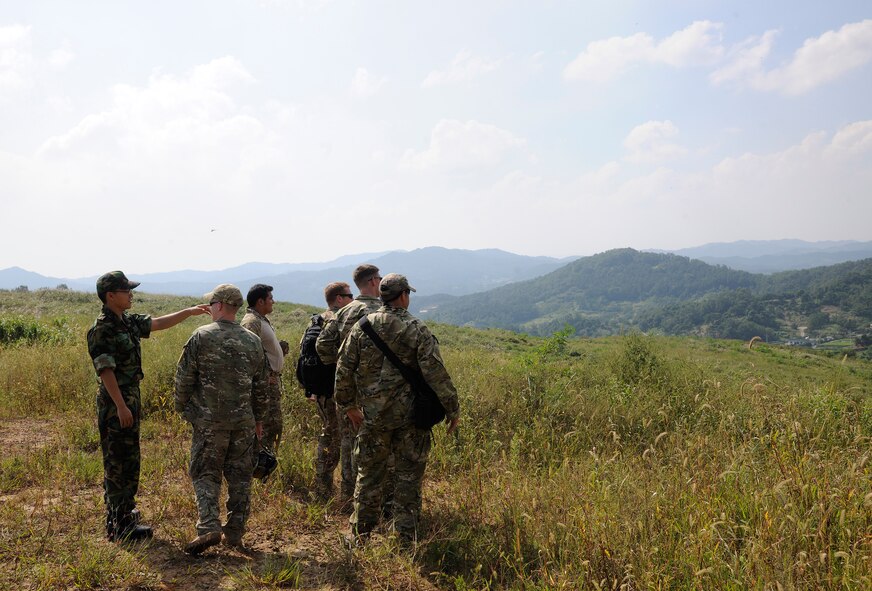 CHEONGJU, Republic of Korea -- A Republic of Korea Air Force survival, evasion, resistance and escape instructor from their Intelligence Training Squadron packs up a parachute here Sept. 15. The U.S. Air Force and ROKAF performed a jump together helping improve relationships with one another and stimulate a continued bilateral partnership on the peninsula. (U.S. Air Force photo/Staff Sgt. Rasheen A. Douglas)