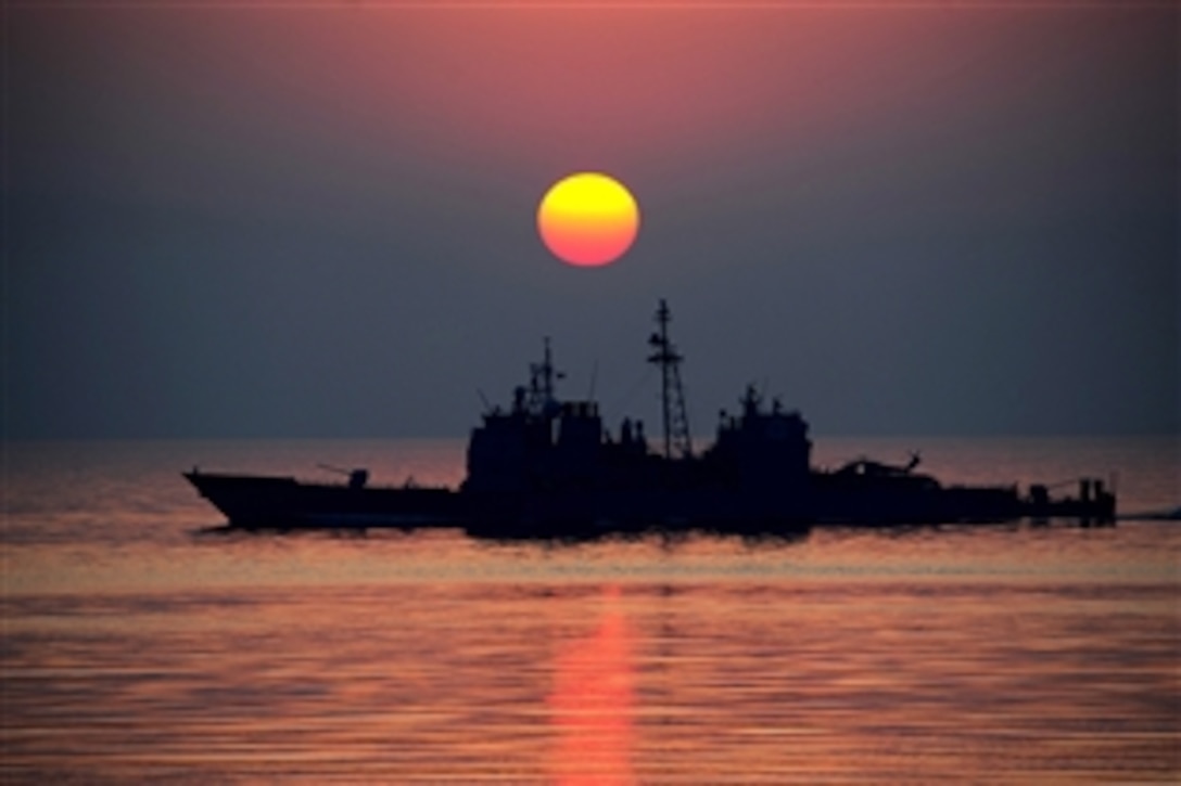 The Ticonderoga-class guided-missile cruiser USS Mobile Bay transits the Arabian Gulf, Sept. 20, 2011. The Mobile Bay is deployed to the U.S. 5th Fleet area of responsibility conducting maritime security operations and support missions as part of operations Enduring Freedom and New Dawn.