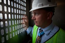 NEW YORK --  Sgt. Dakota Meyer, the first living Marine to be awarded the Medal of Honor for actions since Vietnam, looks out a construction elevator during a tour of the Freedom Tower, Sept. 21. Meyer spoke at a ceremony at the National September 11 Memorial & Museum before touring the Freedom Tower. During his speech he told the audience of mostly veterans, firefighters, police and construction workers, "people have been calling me a hero a lot lately, but you are the real heroes... If this is what being a hero feels like, you can have it." For more information, visit www.dakotameyer.com. (Official Marine Corps photo by Sgt. Randall A. Clinton / RELEASED)
