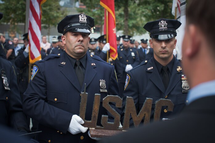 NEW YORK --  Sgt. Dakota Meyer, the first living Marine to be awarded the Medal of Honor for actions since Vietnam, receives a sculpted USMC made from recovered World Trade Center steel, Sept. 21. Meyer spoke at a ceremony at the National September 11 Memorial & Museum before touring the Freedom Tower. During his speech he told the audience of mostly veterans, firefighters, police and construction workers, "people have been calling me a hero a lot lately, but you are the real heros... If this is what being a hero feels like, you can have it."(Official Marine Corps photo by Sgt. Randall A. Clinton / RELEASED)