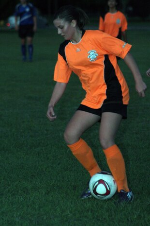 Miranda Allen, a Platypi midfielder, attempts to maintain control of the ball during a 0-0 soccer game at the Matthew C. Perry Soccer field here Sept. 22. Both teams came determined to put points on the board but it was each team’s goalie that proved the deciding factor.