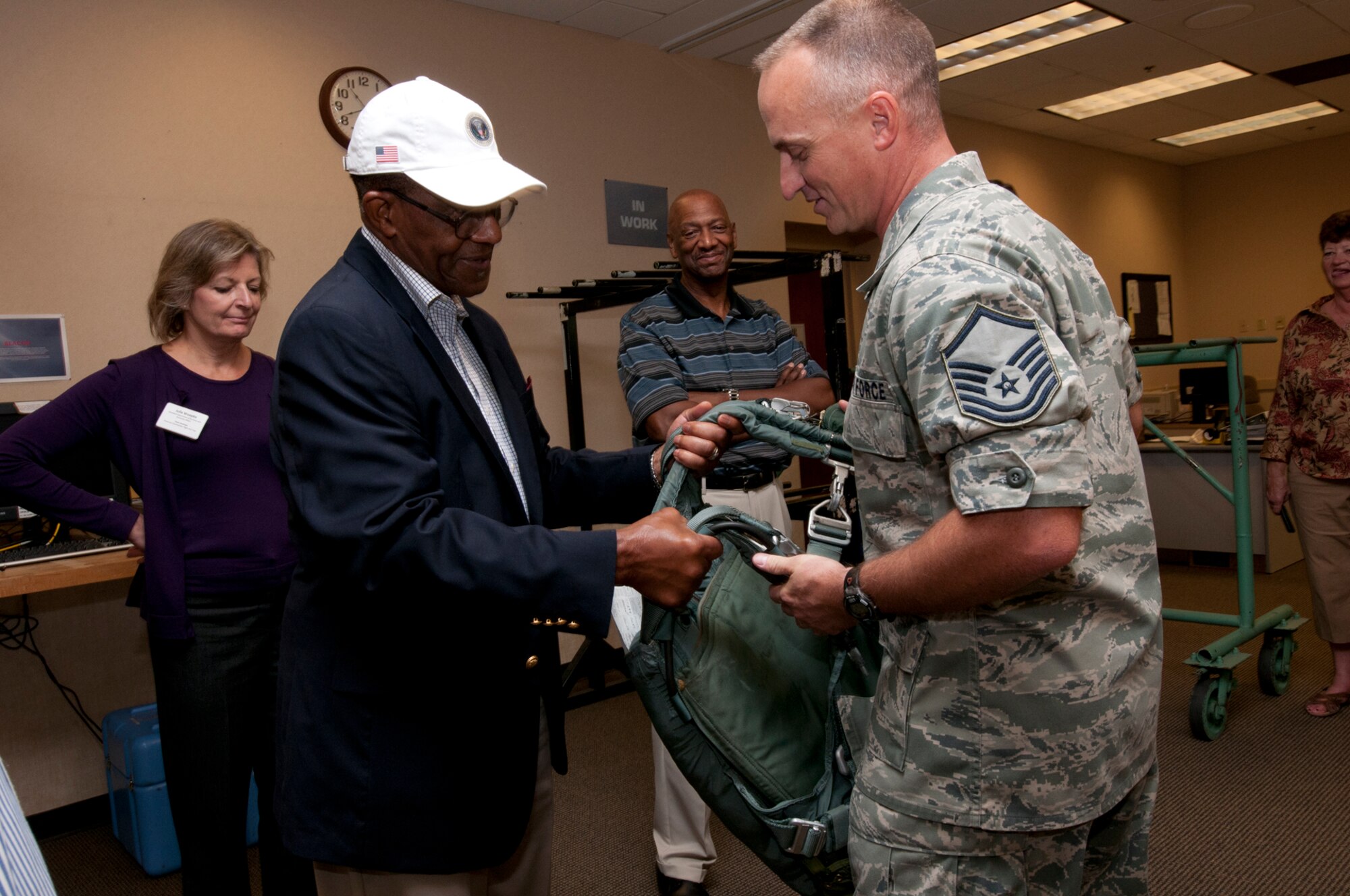 JOINT BASE CHARLESTON, S.C. -- Reserve Master Sgt. Bob Bryan, 315th Operations Support Squadron, explains how aircrew equipment is inspected to honorary commanders and civic leaders from Joint Base Andrews, Md., here Sept. 21. The aircrew equipment briefing was part of a Civic Leader Tour where honorary commanders and civic leaders learned more about the Total Force mission and networked with senior leaders.The honorary commanders also had the opportunity to tour areas like the 437th Aerial Port Squadron and 437th Aircrew Flight Equipment. (U.S. Air Force photo/Tech. Sgt. Steve Lewis)
