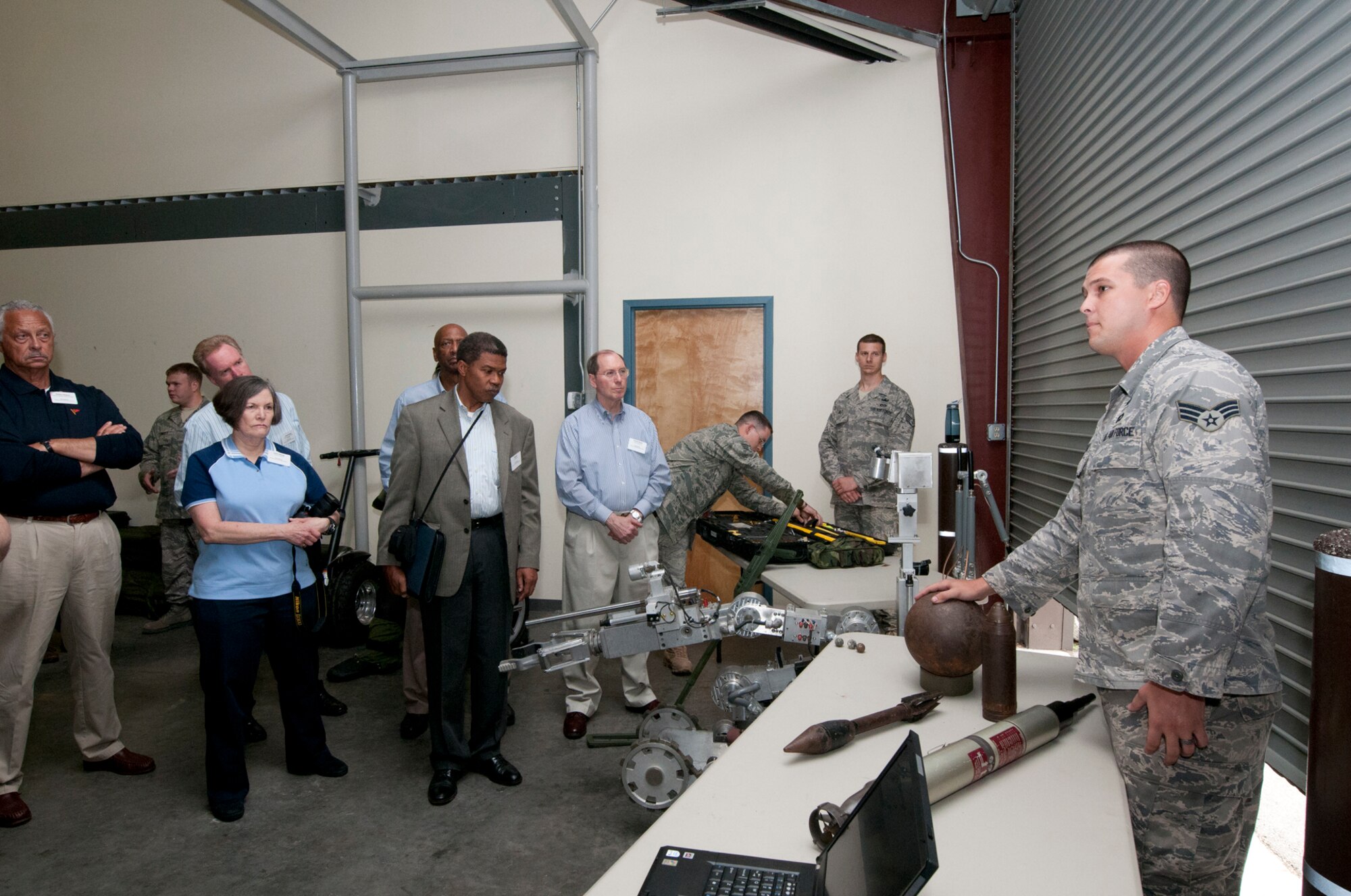 JOINT BASE CHARLESTON, S.C. -- Airmen from the 628th Civil Engineering Squadron brief honorary commanders and civic leaders from Joint Base Andrews, Md., on the Explosive Ordinance Disposal mission here Sept. 20. The EOD briefing was part of a Civic Leader Tour where honorary commanders and civic leaders learned more about the Total Force mission and networked with senior leaders.The honorary commanders also had the opportunity to tour areas like the 437th Aerial Port Squadron and 437th Aircrew Flight Equipment. (U.S. Air Force photo/Tech. Sgt. Steve Lewis)