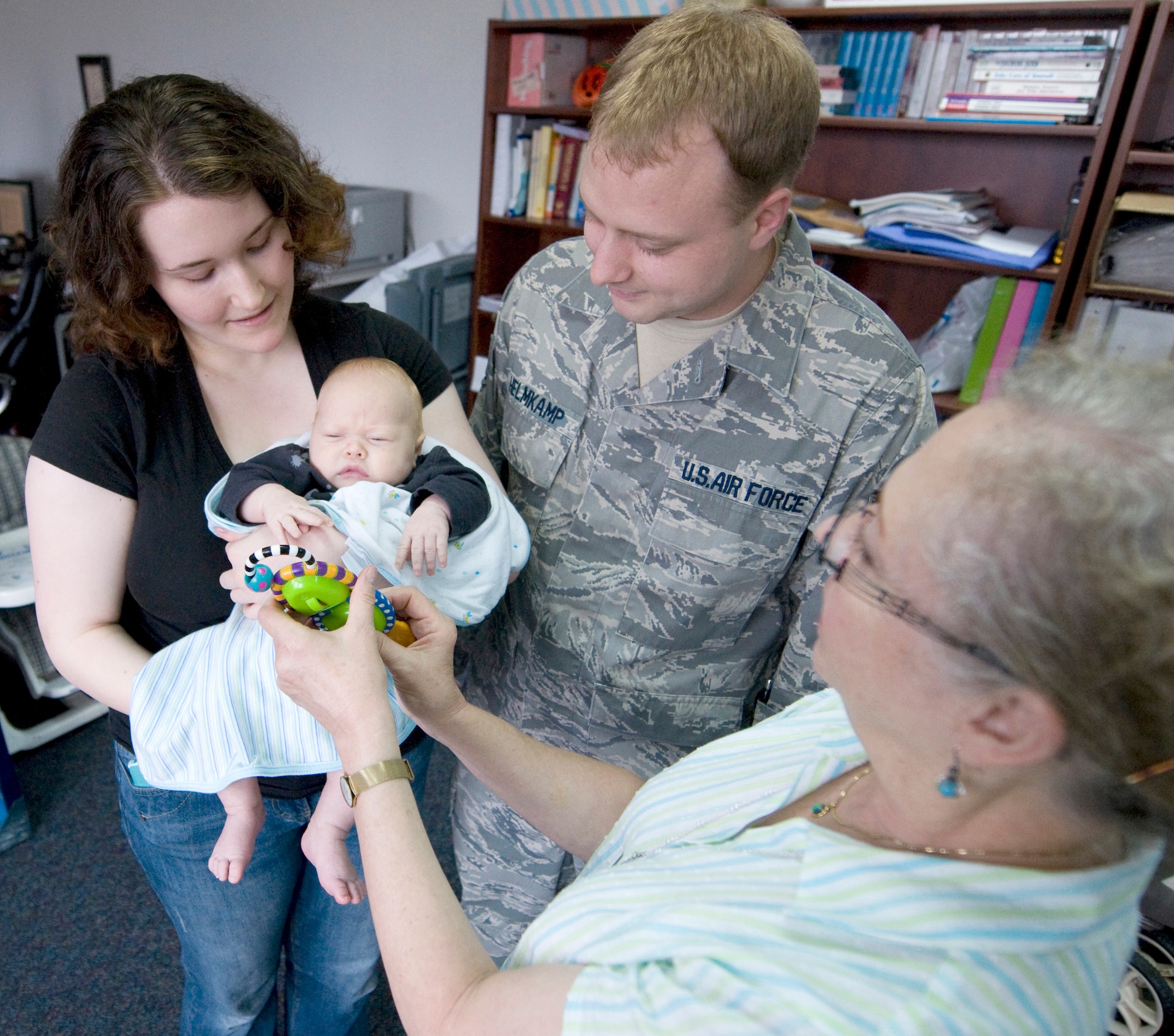 YOKOTA AIR BASE, Japan -- Janet Kokosinski (right), 374th Medical Operations Squadron Family Advocacy nurse, plays with a baby Sept. 21, 2011, at Yokota Air Base, Japan. Yokota's Family Advocacy office offers a variety of free classes ranging from general parenting to stress and anger management. (U.S. Air Force photo/Airman John D. Partlow)