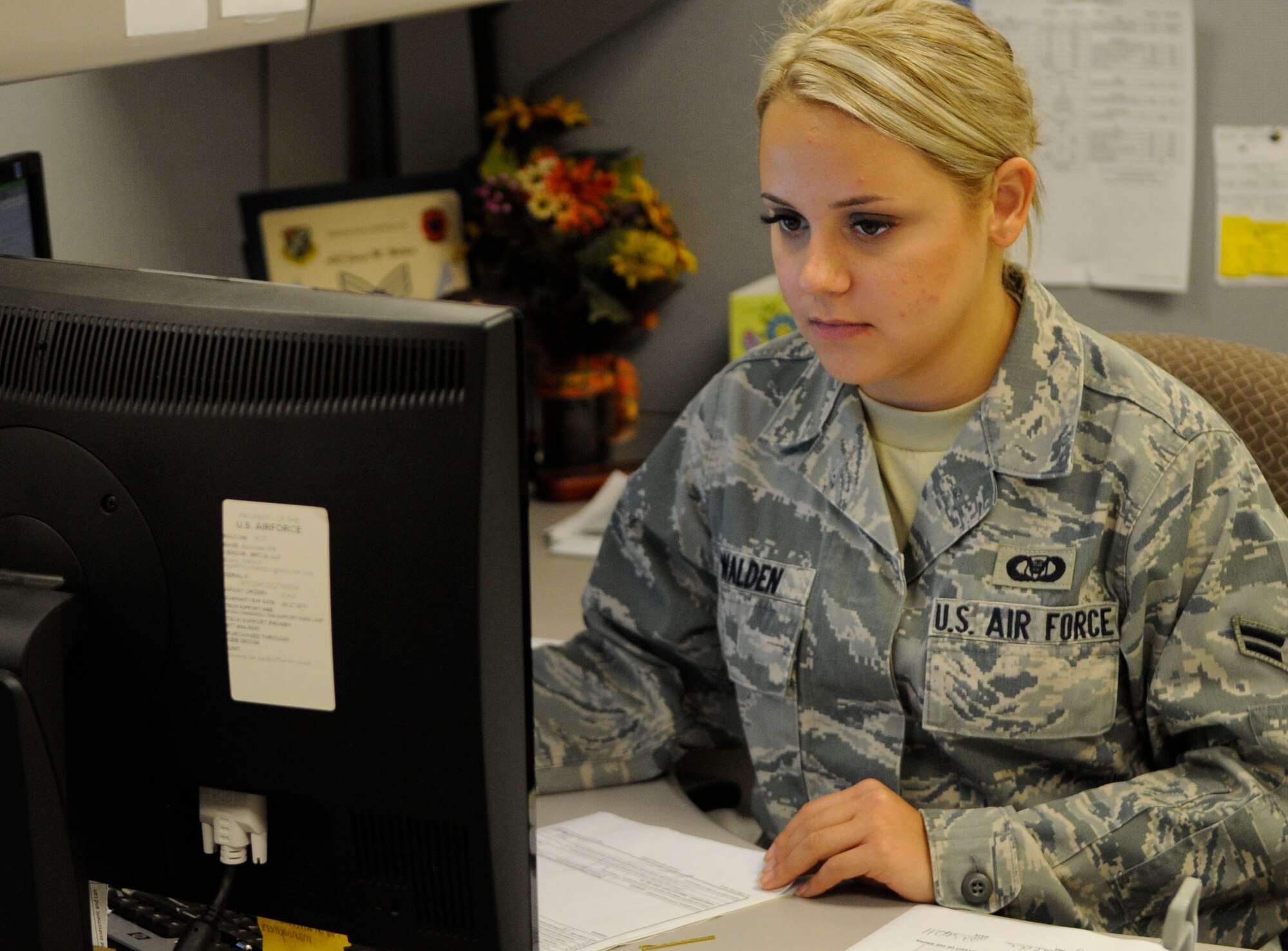 Airman 1st Class Jamie Walden, aviation resource management apprentice for the 2nd Operations Support Squadron, works tentatively Sept. 22 at the 2 OSS on Barksdale Air Force Base, La.  Walden was one of 30 on base to help earn the United States Air Force Outstanding Aviation Resource Management Sergeant Dee Campbell Small Unit Team of the Year 2010 award. (U.S. Air Force photo/Airman 1st Class Andrea F. Liechti) (RELEASED)