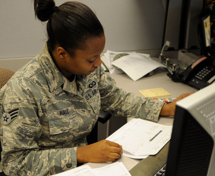 Senior Airman Tiffany Hall, flight record apprentice for the 2nd Operations Support Squadron, reviews paperwork Sept. 22 at the 2 OSS on Barksdale Air Force Base, La.  Hall was one of 30 on base to help earn the United States Air Force Outstanding Aviation Resource Management Sergeant Dee Campbell Small Unit Team of the Year 2010 award. (U.S. Air Force photo/Airman 1st Class Andrea F. Liechti) (RELEASED)