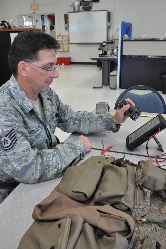 YOUNGSTOWN AIR RESERVE STATION, Ohio -- Air Force Reserve Tech. Sgt. Joseph Delzotti, a life support equipment craftsman with the 910th Airlift Wing, inspects an Air Ace Survival Vest to ensure it is ready for any contingency. U.S. Air Force photo by Maj. Brent J. Davis