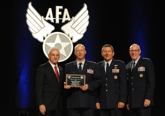 Air Force Academy Chaplain (Capt.) Chad Zielinski receives the Chaplain Corps Award  during the Air Force Association's Air and Space Conference and Technology Exposition Monday in National Harbor, Md. S. Sanford Schlitt, chairman of the AFA board, left, presented the award. Lt. Gen. Mike Gould, Academy superintendent (second from right) and Maj. Gen. Cecil Richardson, Air Force chief of chaplains, are also pictured. (U.S. Air Force photo/Master Sgt. Thomas A. Coney)