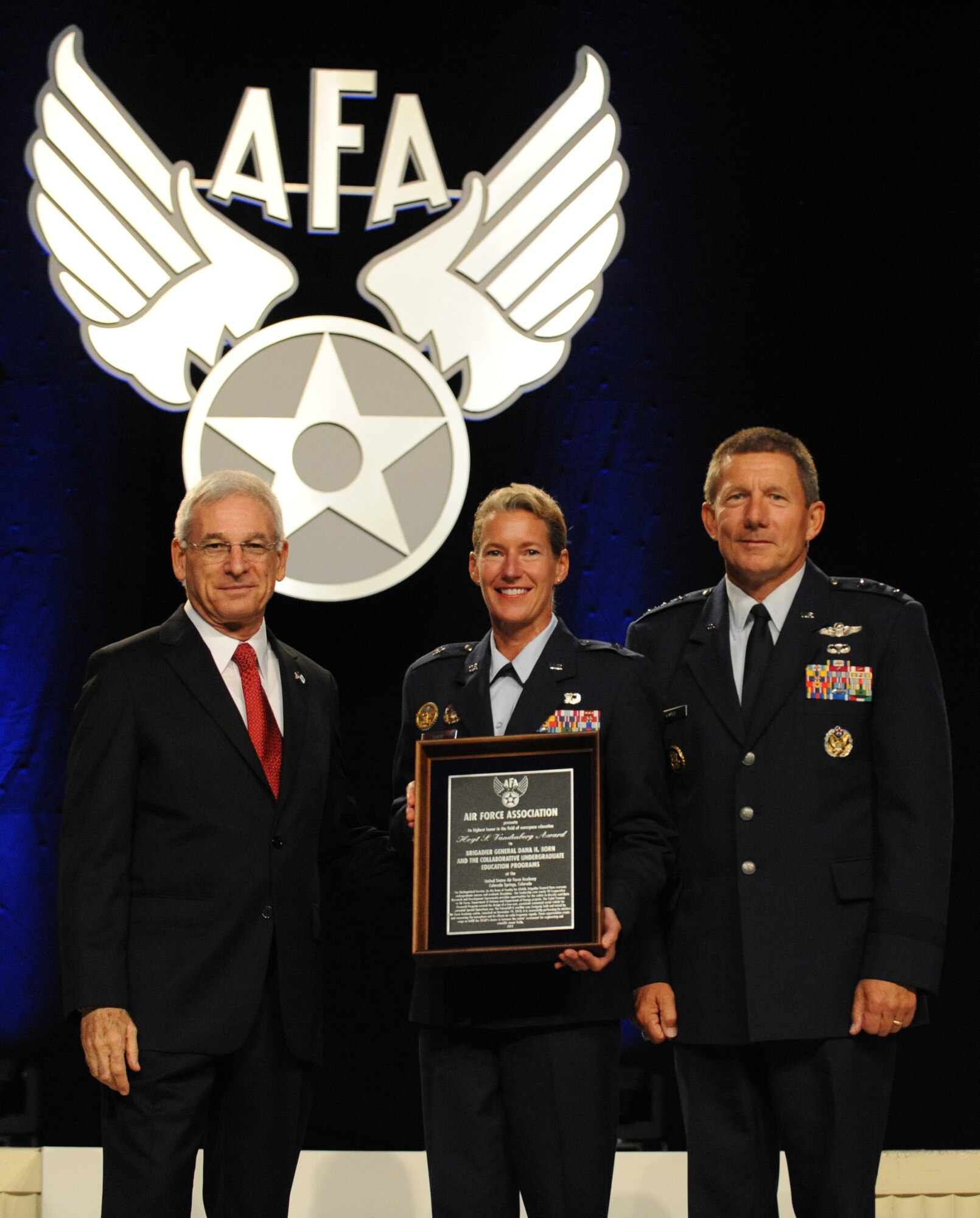 Air Force Academy Dean of the Faculty Brig. Gen. Dana Born (center) accepts the Hoyt S. Vandenberg Award for outstanding contribution in aerospace education from S. Sanford Schlitt, chairman of the board of the Air Force Association (left) during the Air and Space Conference and Technology Exposition Sept. 19, 2011, in National Harbor, Md. Academy Superintendent Lt. Gen. Mike Gould is also pictured. (U.S. Air Force photo/Master Sgt. Thomas A. Coney)