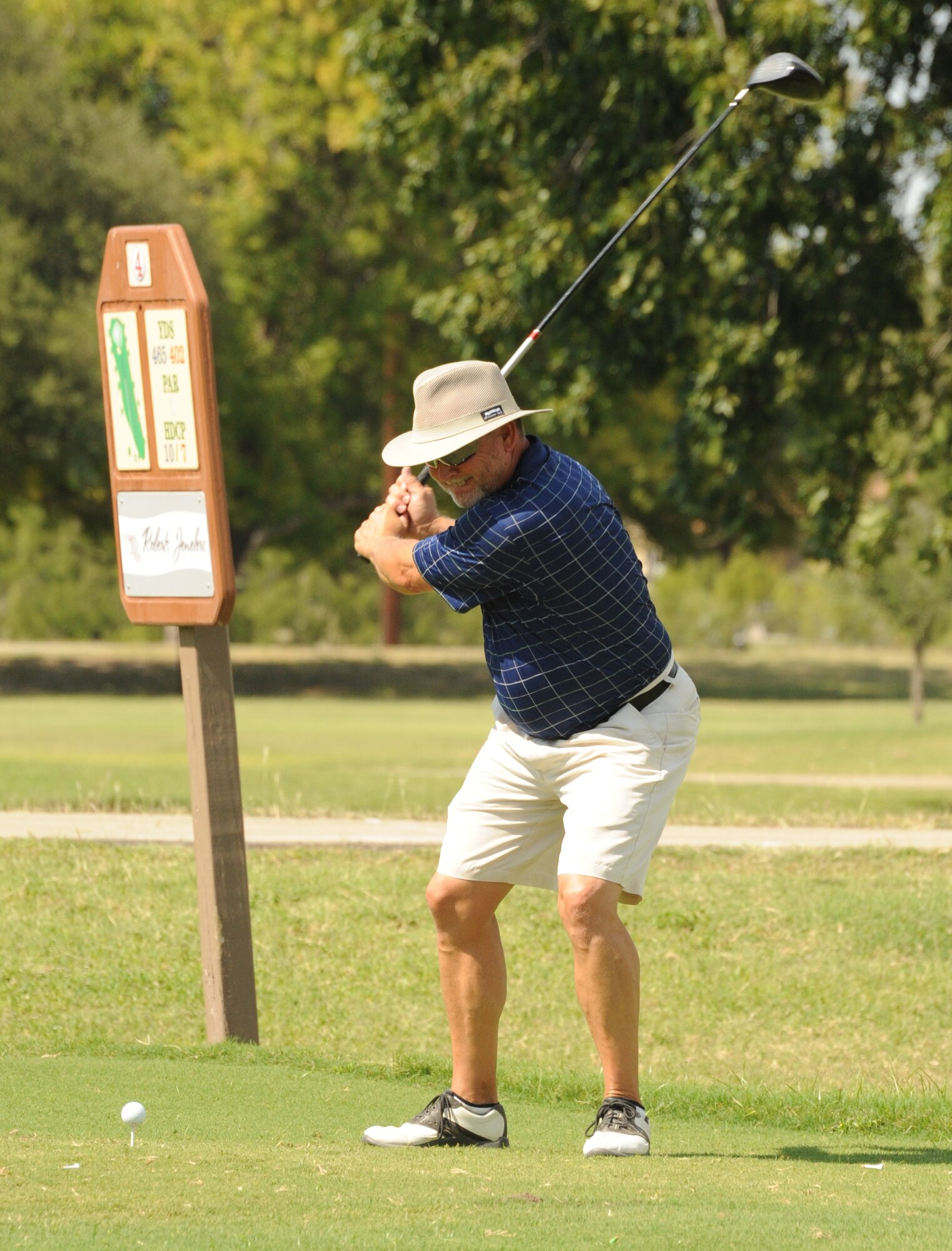 LAUGHLIN AIR FORCE BASE, Texas – Tommy Sondag, 47th Operations Support Squadron, tees off on the fourth hole of Laughlin’s Leaning Pines Golf Course Sept. 21 during the intramural golf championship round. The 47th OSS team outshot the team from the 84th and 85th Flying Training Squadrons to claim the title. (U.S. Air Force photo/Senior Airman Blake Mize)