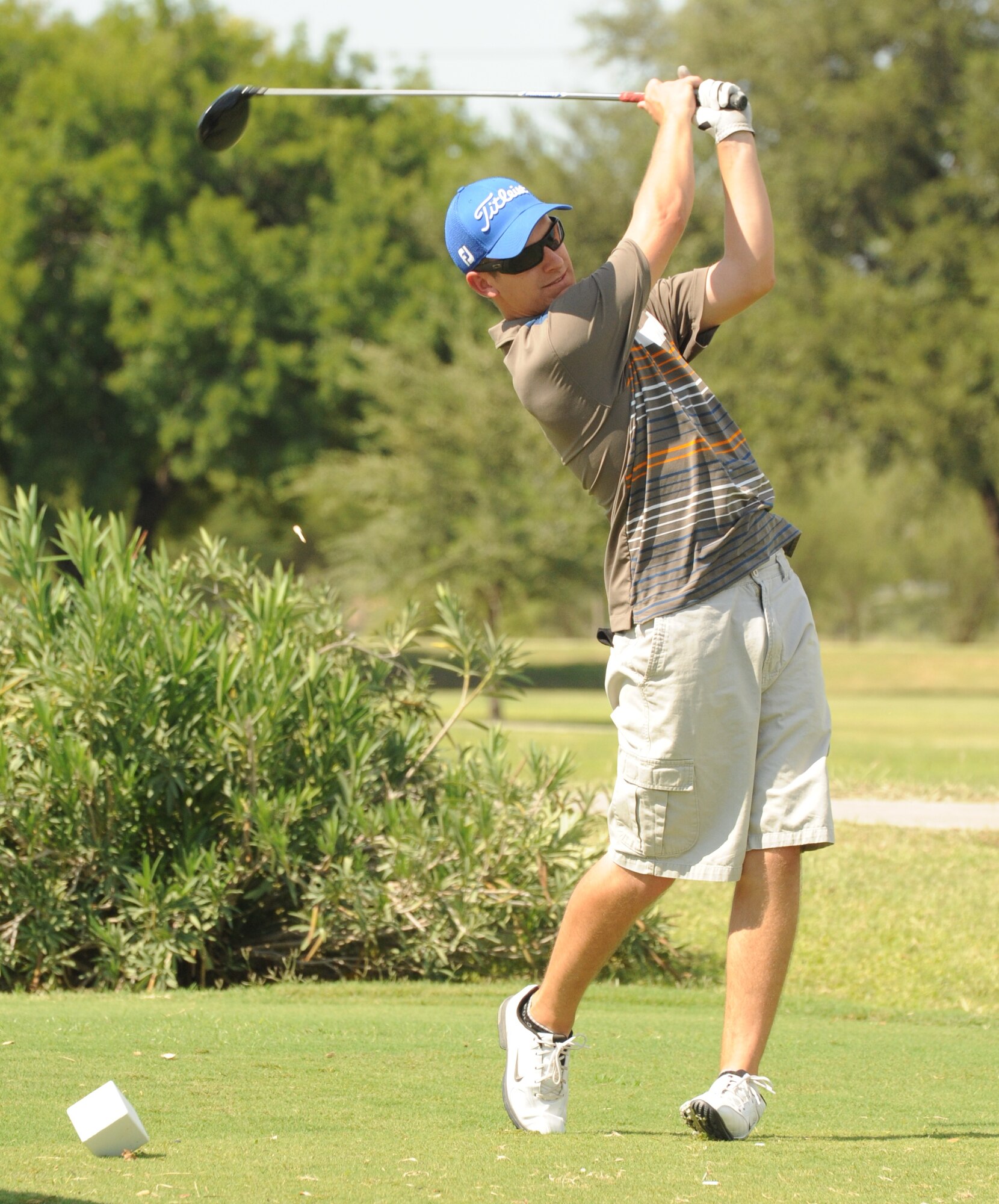 LAUGHLIN AIR FORCE BASE, Texas – Senior Airman Richard Weatherby, 47th Operations Support Squadron, tees off on the fourth hole of Laughlin’s Leaning Pines Golf Course Sept. 21 during the intramural golf championship round. The 47th OSS team outshot the team from the 84th and 85th Flying Training Squadrons to claim the title. (U.S. Air Force photo/Senior Airman Blake Mize)