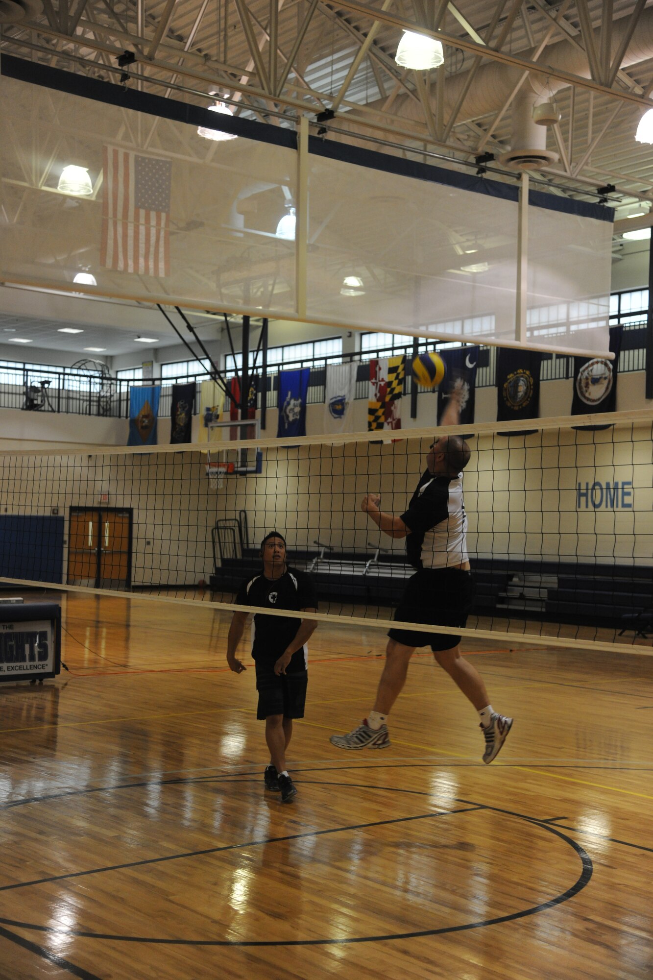 Joey Lee and Christopher Boykins, members of the 23rd Medical Group, practice spiking drills before an intramural volleyball championship game at Moody Air Force Base, Ga., Sept 21, 2011. Moody’s intramural volleyball season began in mid June. (U.S. Air Force photo by Airman 1st Class Paul Francis/Released)
