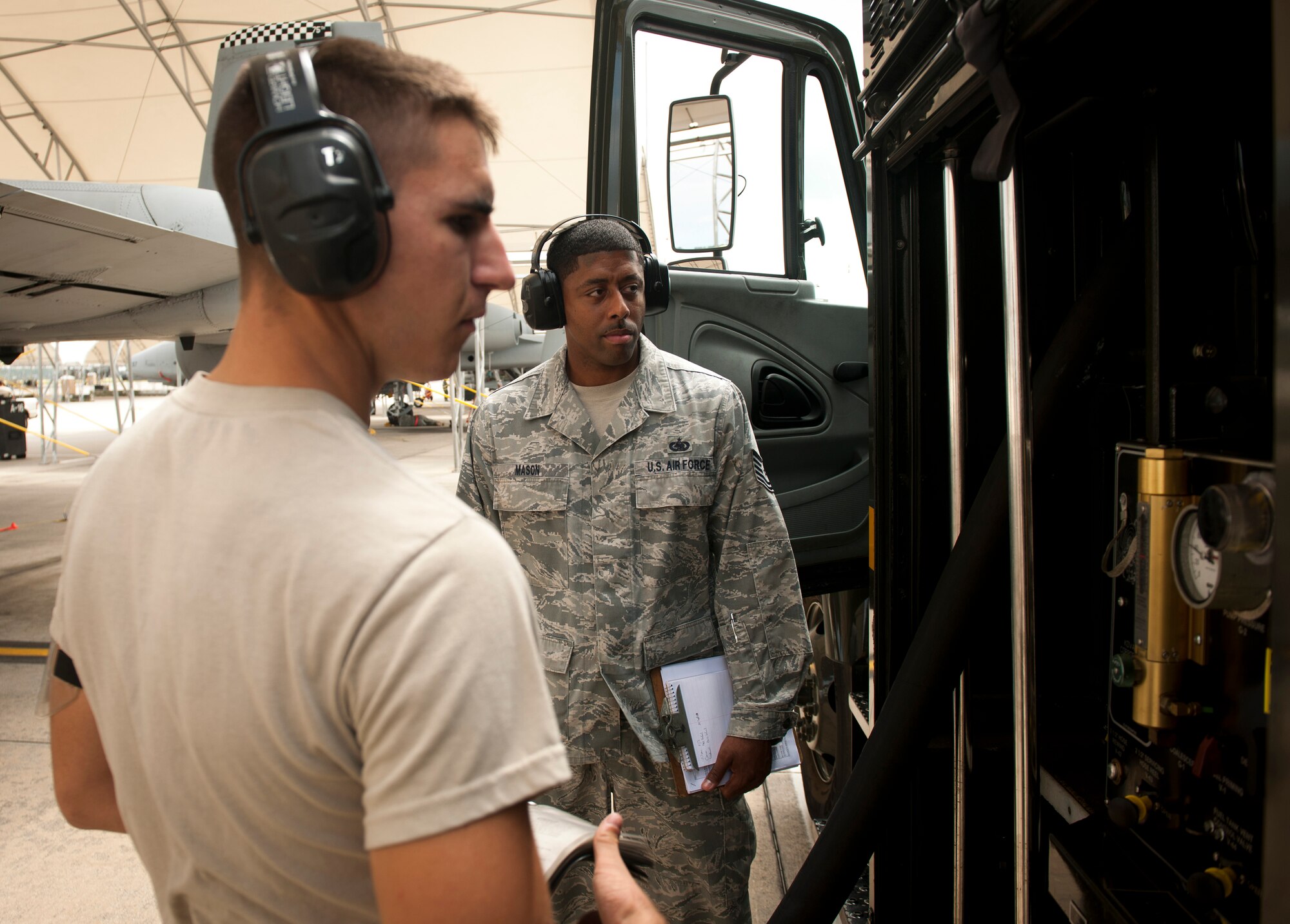 U.S. Air Force Tech. Sgt. Carlos Mason 23rd Logistics Readiness Squadron fuels quality assurance inspector, observes Airman 1st Class Kyle Dadswell, 23rd LRS fuels distribution operator, during a no-notice quality assurance inspection at Moody Air Force Base, Ga., Sept. 20, 2011. Mason observed and asked questions pertaining to the refueling process as well as checked for Dadwell’s proficiency in performing tasks. (U.S. Air Force photo by Airman 1st Class Joshua Green/Released)
