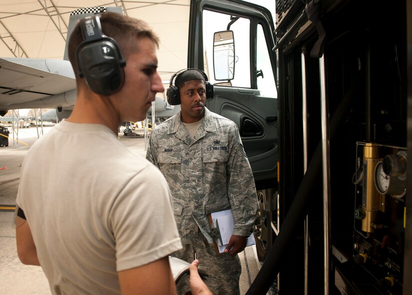 U.S. Air Force Tech. Sgt. Carlos Mason 23rd Logistics Readiness Squadron fuels quality assurance inspector, observes Airman 1st Class Kyle Dadswell, 23rd LRS fuels distribution operator, during a no-notice quality assurance inspection at Moody Air Force Base, Ga., Sept. 20, 2011. Mason observed and asked questions pertaining to the refueling process as well as checked for Dadwell’s proficiency in performing tasks. (U.S. Air Force photo by Airman 1st Class Joshua Green/Released)
