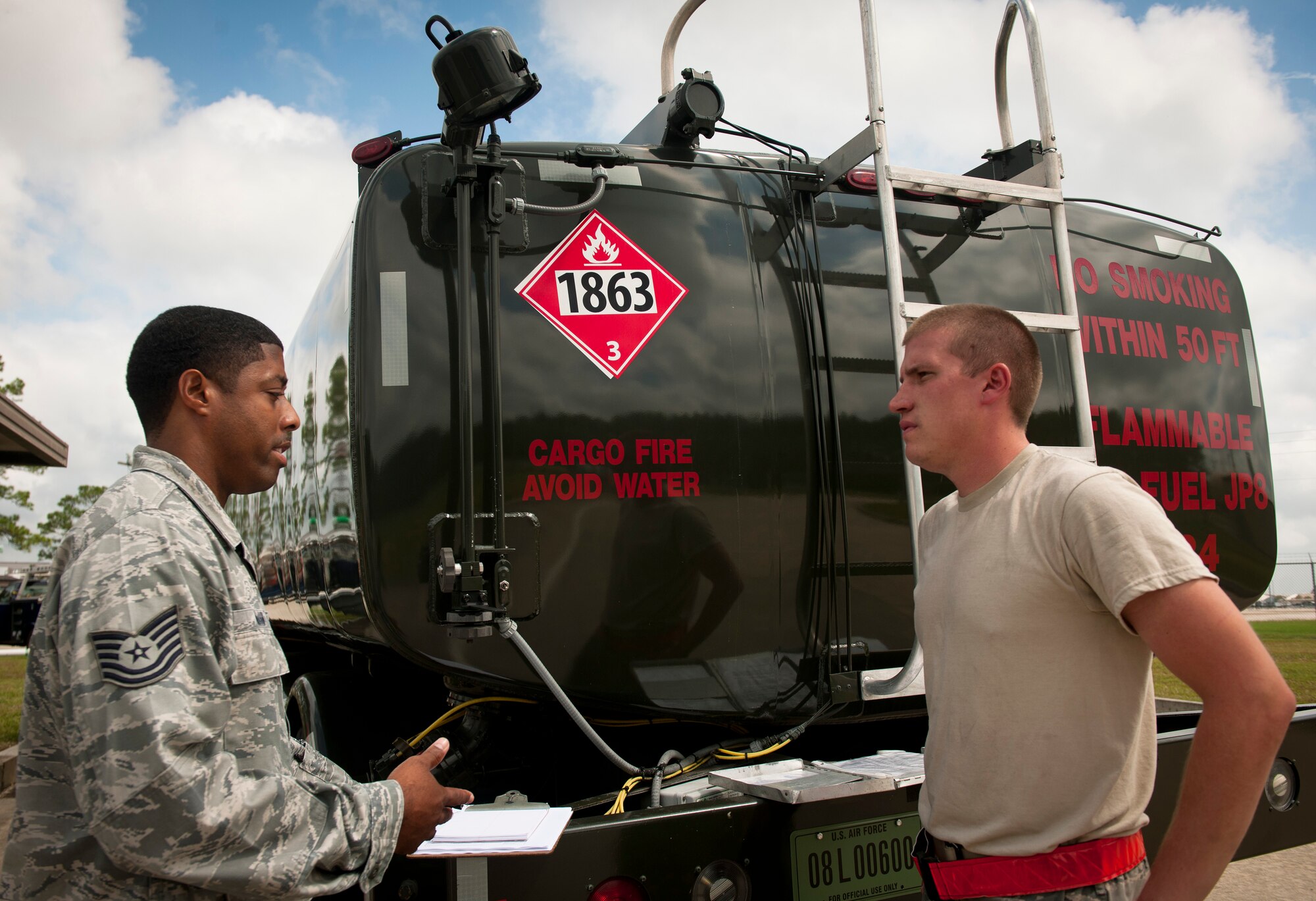 U.S. Air Force Tech. Sgt. Carlos Mason, 23rd Logistics Readiness Squadron fuels quality assurance inspector, explains to Airman 1st Class Justin Wilson, 23rd LRS fuels distribution operator, that he’ll be given a no-notice quality assurance inspection at Moody Air Force Base, Ga., Sept. 20, 2011. The 23rd LRS has implemented a new quality assurance program to provide the unit commander and senior leadership with an assessment of the unit’s ability to perform key logistics processes. (U.S. Air Force photo by Airman 1st Class Joshua Green/Released)
