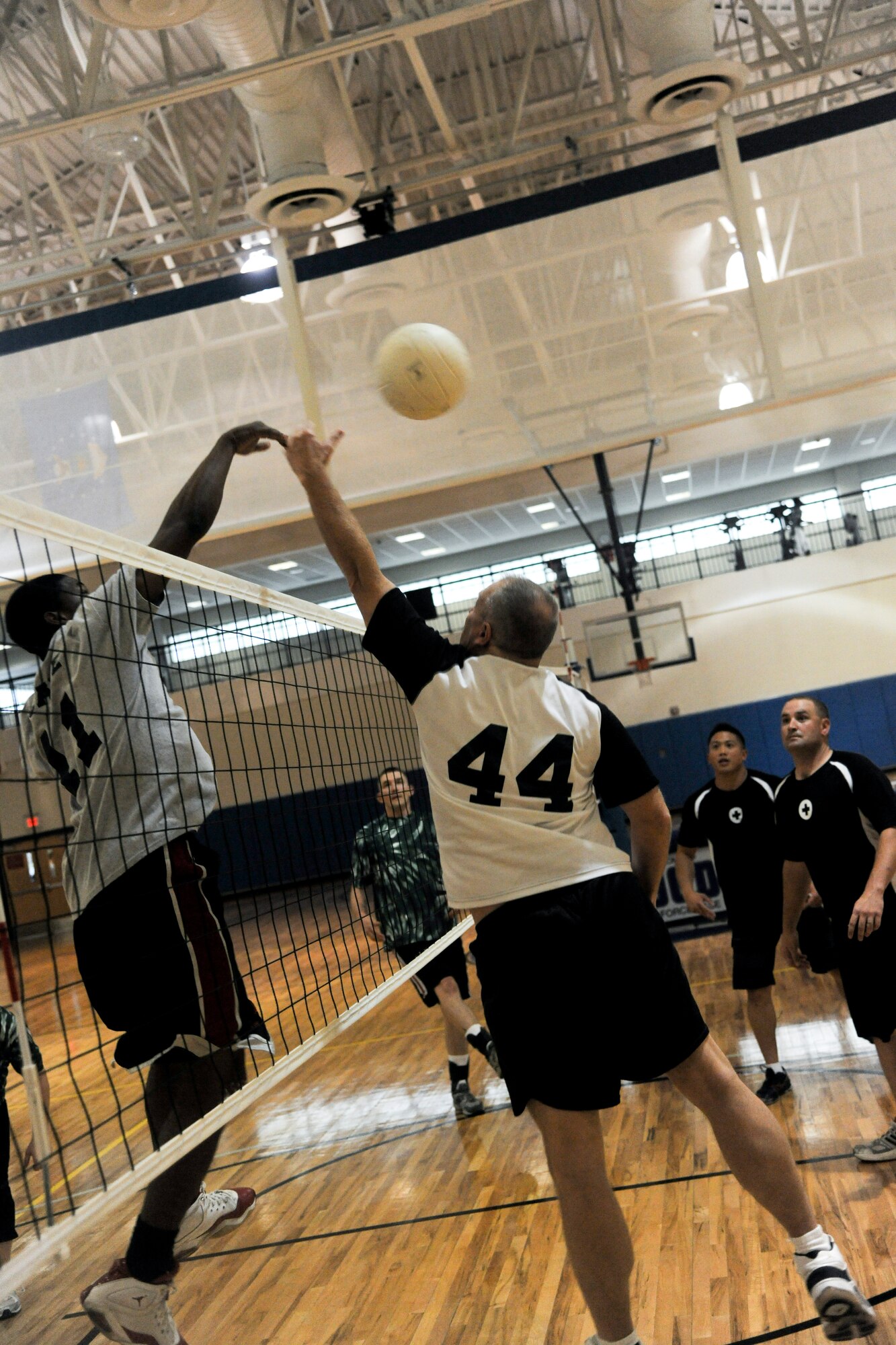 Derico English, 723rd Aircraft Maintenance Squadron, spikes a volleyball over the net during an intramural volleyball championship game at Moody Air Force Base, Ga., Sept. 21, 2011. The play resulted in a score by the 723rd AMXS, which brought the team to within two points of the lead. (U.S. Air Force photo by Airman 1st Class Paul Francis/Released)
