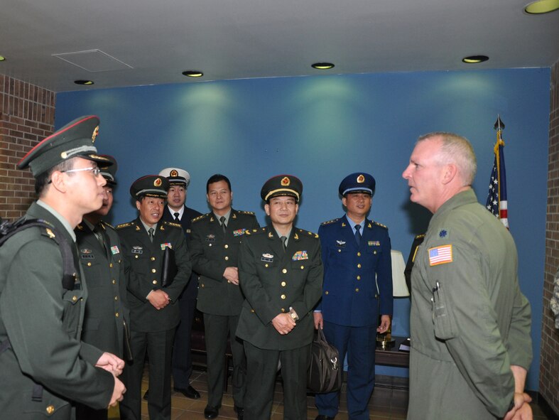 Lt. Col. William Graham, a C-130 navigator from the 302nd Airlift Wing's 731st Airlift Squadron welcomed a delegation from the People's Liberation Army. The group that included Maj. Gen. Tang, Fen the Director of Mass Work Office of the General Political Department (center) visited the Reserve Wing to learn about their Modular Airborne Firefighting System mission. The 302nd was one of many stops for the Chinese delegation during their U.S. Northern Command sponsored, three-day visit to the U.S. which was intended to enhance U.S. and Chinese dialogue, and foster relations on humanitarian assistance and disaster operations. (U.S. Air Force photo/Tech. Sgt. Peter Dean)