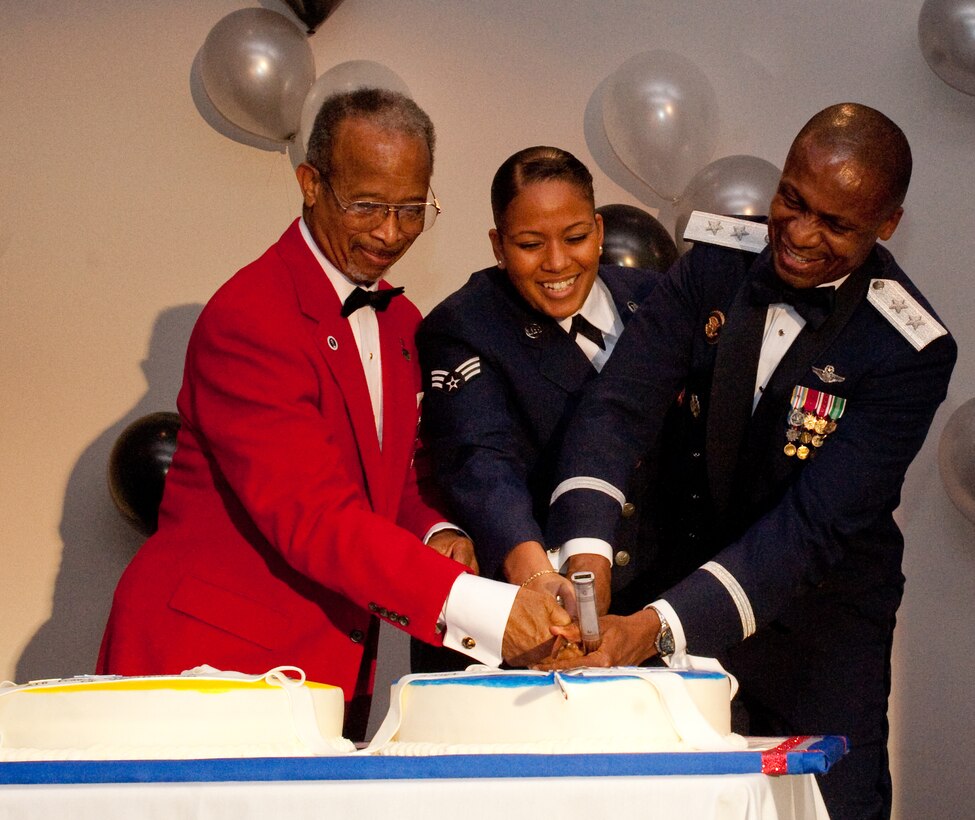 JOINT BASE ANACOSTIA-BOLLING, Washington, D.C. --Retired Lt. Gen. Russell
Davis, and Tuskegee Airmen, Inc. former president; Senior Airman Christine Peters, 579th Medical Group aerospace medicine technician, and Maj. Gen. Darren W. McDew, Air Force District of Washington commander, cut an Air Force Birthday cake at the Joint Base Anacostia-Bolling Club Sept. 16. The cake ceremony is traditionally reserved for the oldest and youngest members in the Air Force. (Photo by Bobby Jones)
