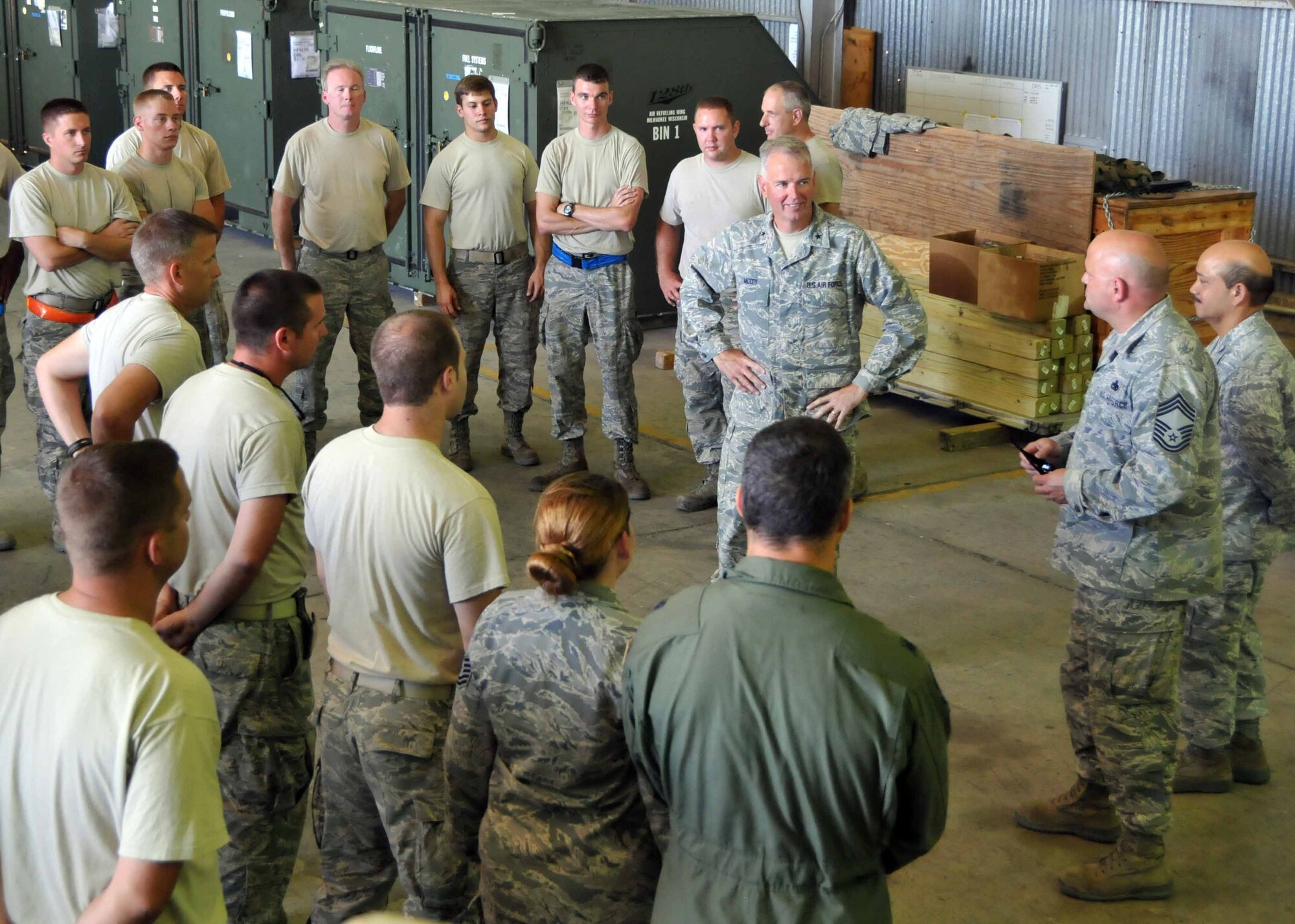 Brig. Gen. John E. McCoy, Assistant Adjutant General for Air, Wisconsin Air National Guard talks with Airmen during a visit to the 313th Air Expeditionary Wing in Western Europe on Saturday, July 30, 2011. (U.S. Air Force photo/Capt. John Capra)