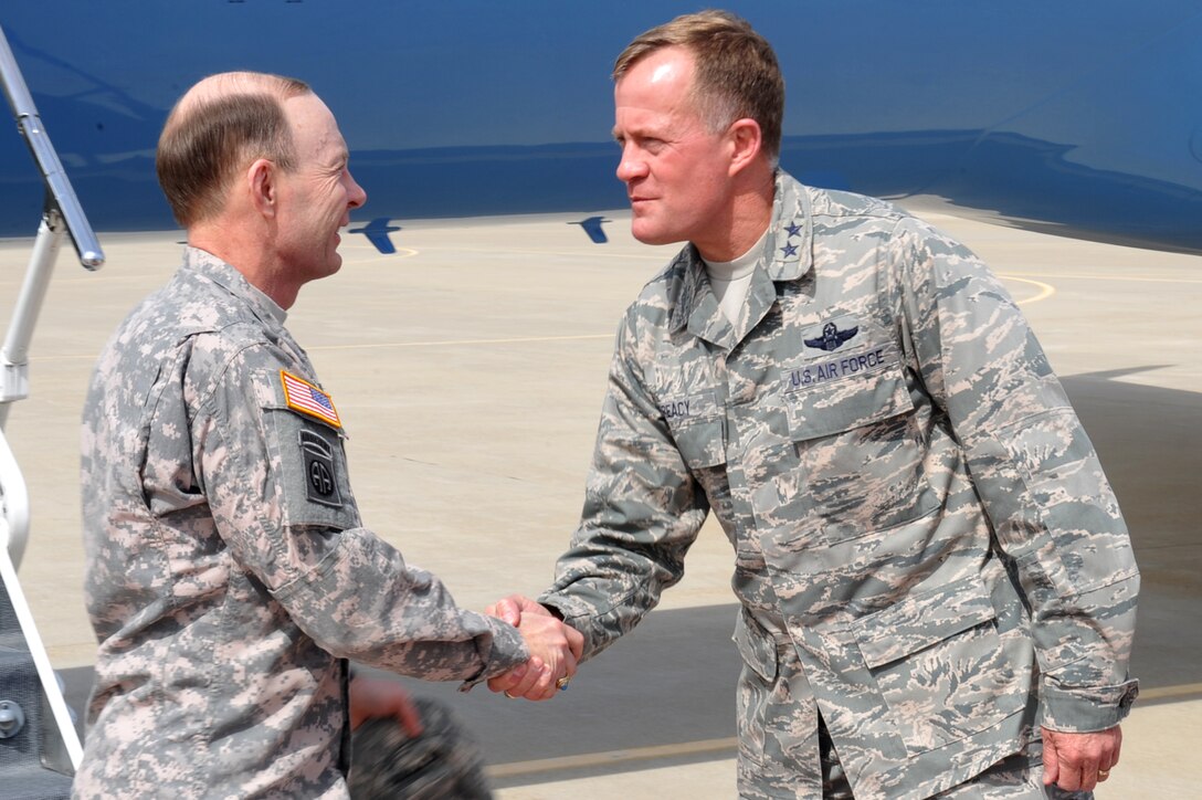 U.S. Army Gen. Charles H. Jacoby Jr., U.S. Northern Command commander, greets U.S. Air Force Maj. Gen. Jonathan T. Treacy, Joint Task Force and Civil Support commander, after stepping off a plane at Langley Air Force Base Sept. 21, 2011.  Jacoby visited Joint Base Langley-Eustis during his tour of military installations throughout the Hampton Roads region.  (U.S. Air Force photo by Staff Sgt. Logan Tuttle/released)  
