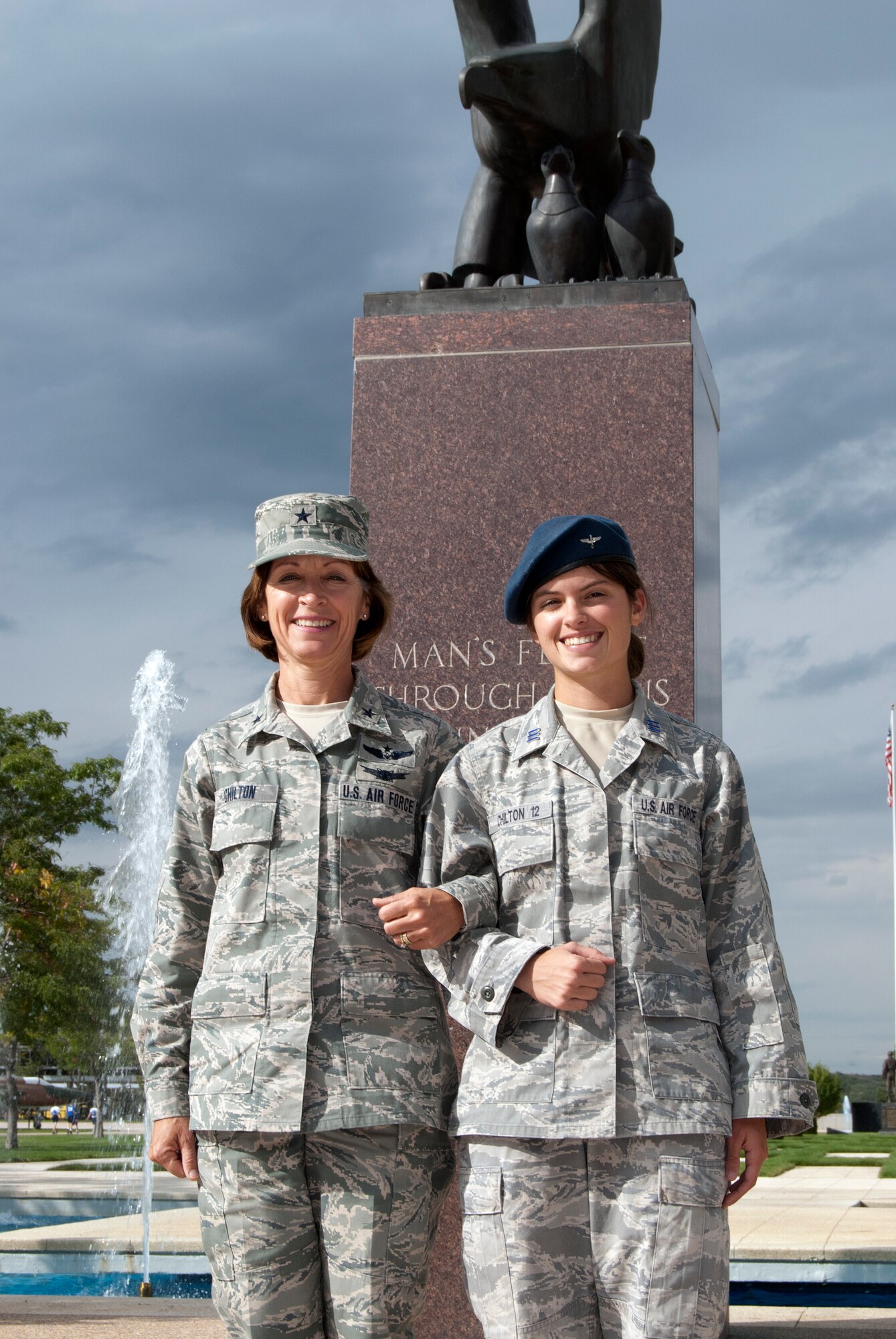 Brig. Gen. Cathy Chilton and her daughter, Cadet 1st Class Madison Chilton, pose for a photo near the Eagle and Fledglings statue at the Air Force Academy Sept. 21, 2011. Madison, a physics major in Cadet Squadron 05, is the fourth generation of her family to serve in the Air Force. General Chilton is the mobilization assistant to the Academy superintendent. (U.S. Air Force photo/Don Branum)