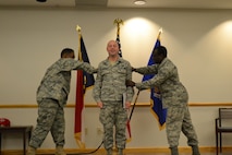 Airman First Class Joshua Stephens is promoted to the rank of senior airman..  Maj. Bryan Alston (left), current interim Red Horse commander, and supervisor Staff Sgt. Henry Jacobs do the honors of pinning on the new rank. (USAF photo courtesy of 567RHS)