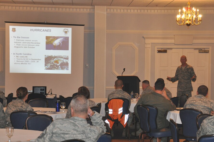 Tech. Sgt. Michael English, NCOIC 4th Civil Engineer Squadron emergency management flight on Seymour Johnson Air Force Base, N.C., briefs Airmen and civilians, who recently arrived to base, about the local hurricane season at the Right Start briefing, Sept. 20, 2011. English explains how to prepare for a hurricane and how to stay safe during adverse weather. Right Start is a mandatory briefing for all recent arriving Airmen and civilians. English is a native of Washington, Ga. (U.S. Air Force photo by Airman 1st Class Mariah Tolbert)