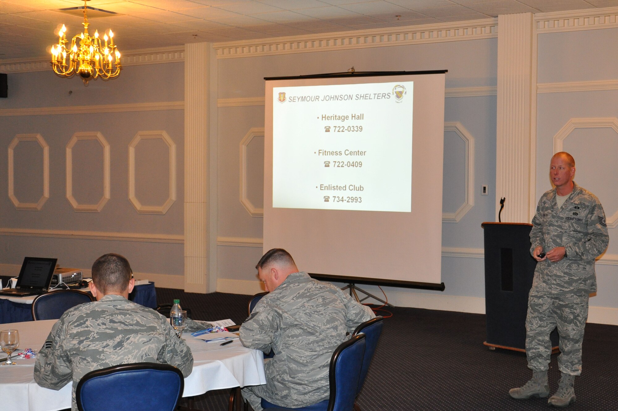 Tech. Sgt. Michael English, NCOIC 4th Civil Engineer Squadron emergency management flight at Seymour Johnson Air Force Base, N.C., briefs new Airmen and base personnel during the Right Start briefing at Eagles Landing, Sept. 20, 2011. English briefs shelter locations on base and what to do during an on-base emergency.  Right Start is a mandatory program that provides information about the base to new Airmen and civilians so they stay connected with base happenings. English is a native of Washington, Ga. (U.S. Air Force photo by Airman 1st Class Mariah Tolbert)