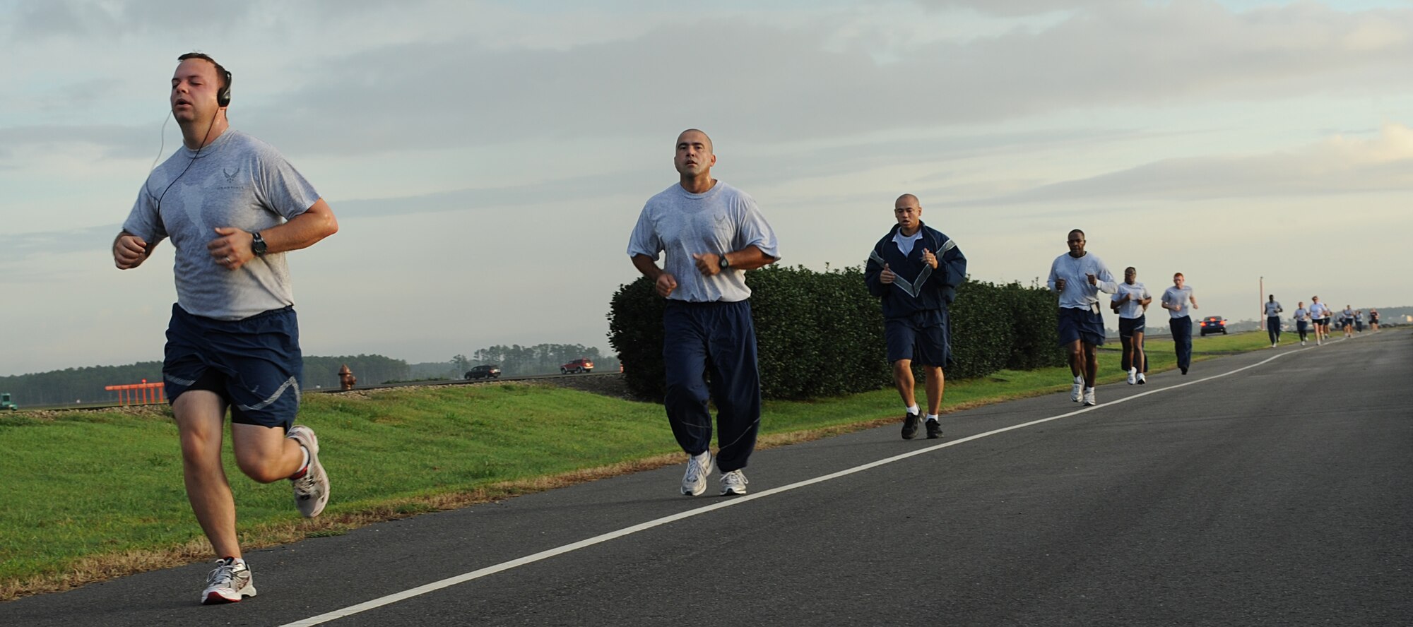 Volunteers run during the Combined Federal Campaign 5K Run, Langley Air Force Base, Va., Sept. 22, 2011. Pledges to the CFC made by Federal civilian, postal and military donors support eligible non-profit organizations that provide health and human service benefits throughout the world. (U.S. Air Force photo by Airman 1st Class Teresa Cleveland/Released)