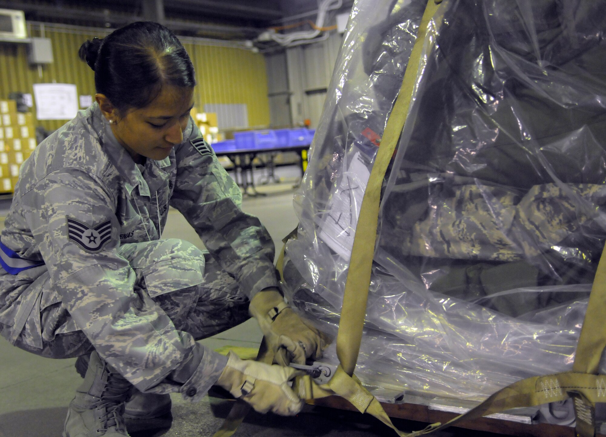 SSgt Kimberly Duenas, 31st Dental Squadron dental lab technician, secures equipment during the in-checking process as part of an operational readiness exercise. Duenas is assigned to the ORE's cargo deployment function team. (U.S. Air Force photo/Airman 1st Class Briana Jones)