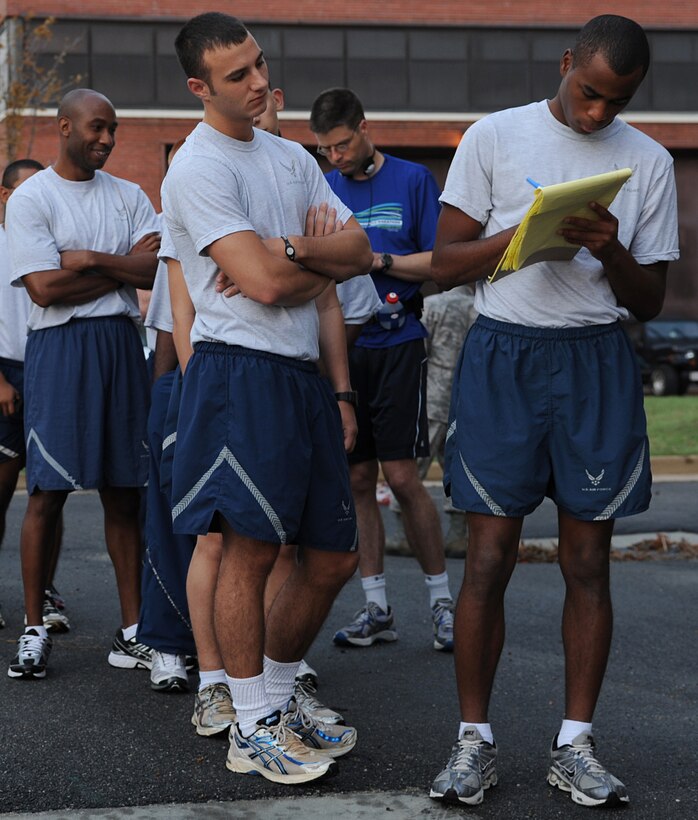 Volunteer runners sign in for the Combined Federal Campaign 5K Run, Langley Air Force Base, Va., Sept. 22, 2011. Approximately 100 Langley volunteers ran to kick off the annual campaign, which raises money for various health and human service non-profit organizations. (U.S. Air Force photo by Airman 1st Class Teresa Cleveland/Released)