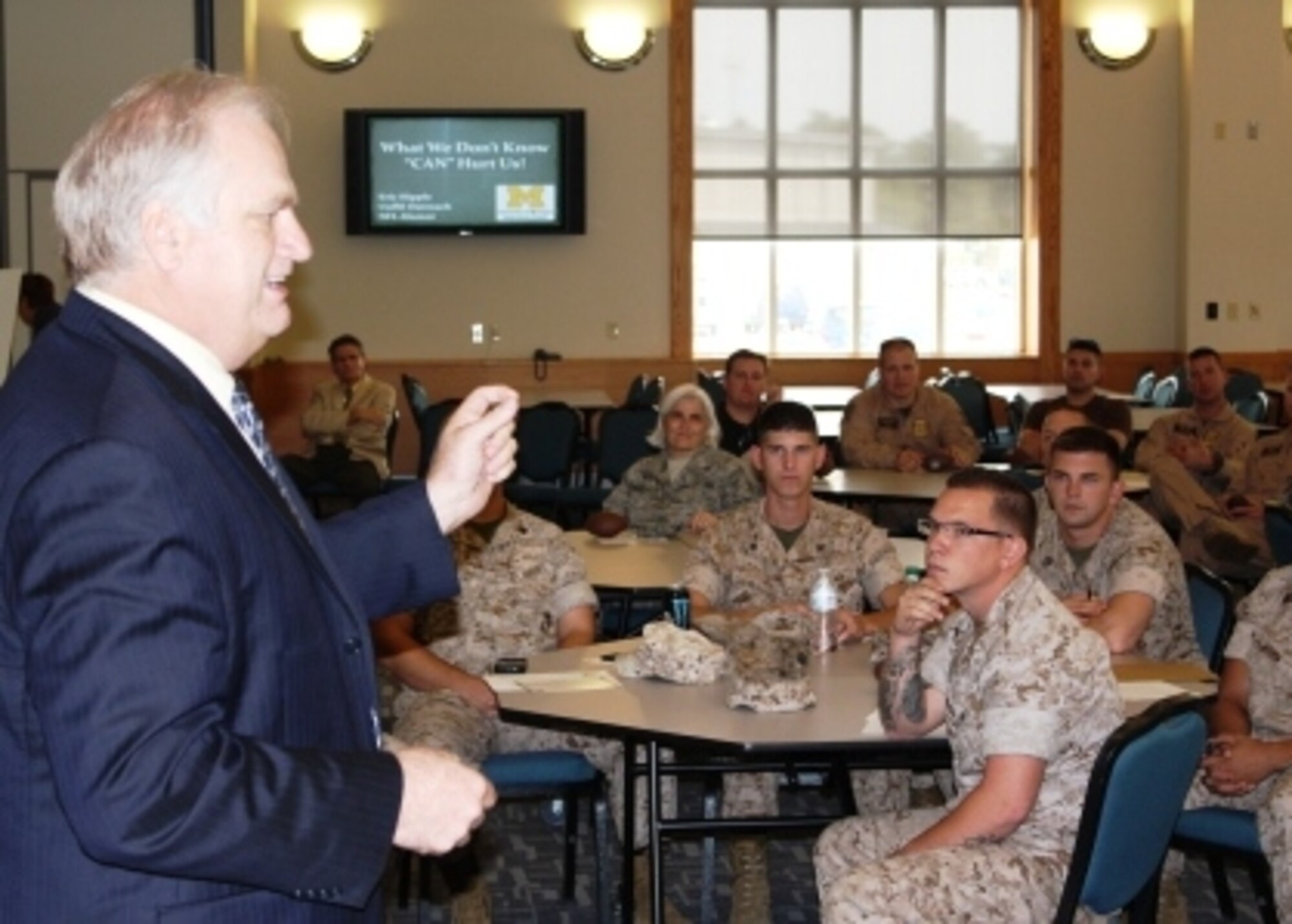 Eric Hipple, a former quarterback with the Detroit Lions, speaks with a group of military and Dept. of Homeland Security personnel, about suicide prevention during a seminar at Selfridge Air National Guard Base, Mich., Sept. 21, 2011. Hipple works with the University of Michigan to help create awareness about depression-related illness. (U.S. Air Force photo by TSgt. Dan Heaton)