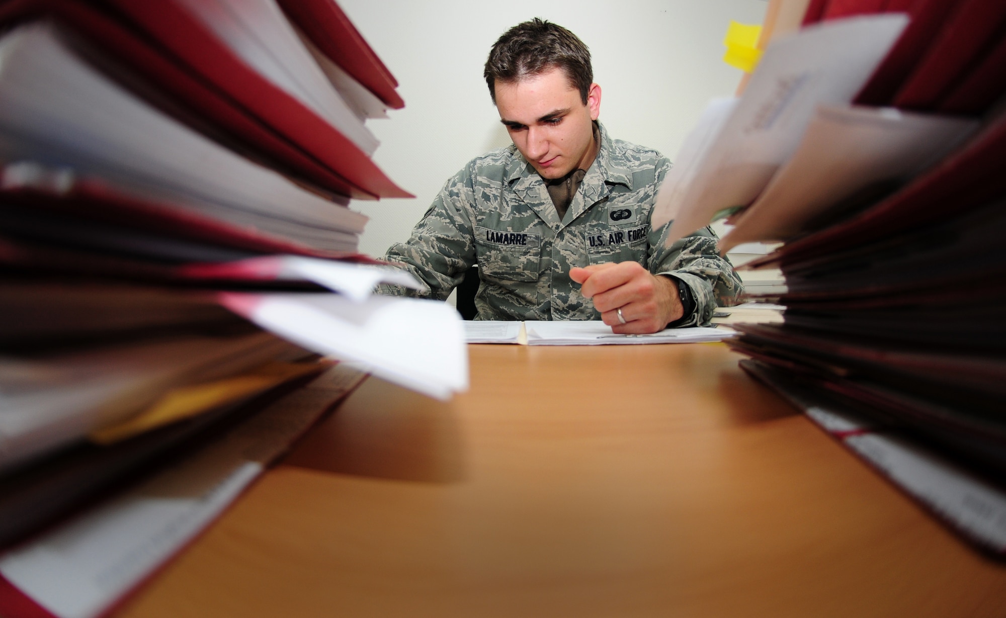 SPANGDAHLEM AIR BASE, Germany – Airman 1st Class Lee Lamarre, 52nd Contracting Squadron contract specialist, reads through recurring service contracts for review here Sept. 21. The 52nd CONS provides supplies and services people need to ensure Spangdahlem AB accomplishes its mission. During the end of the fiscal year, the 52nd CONS works hard to ensure that the materials, equipment and services people use here are purchased. (U.S. Air Force photo/Airman 1st Class Matthew B. Fredericks)