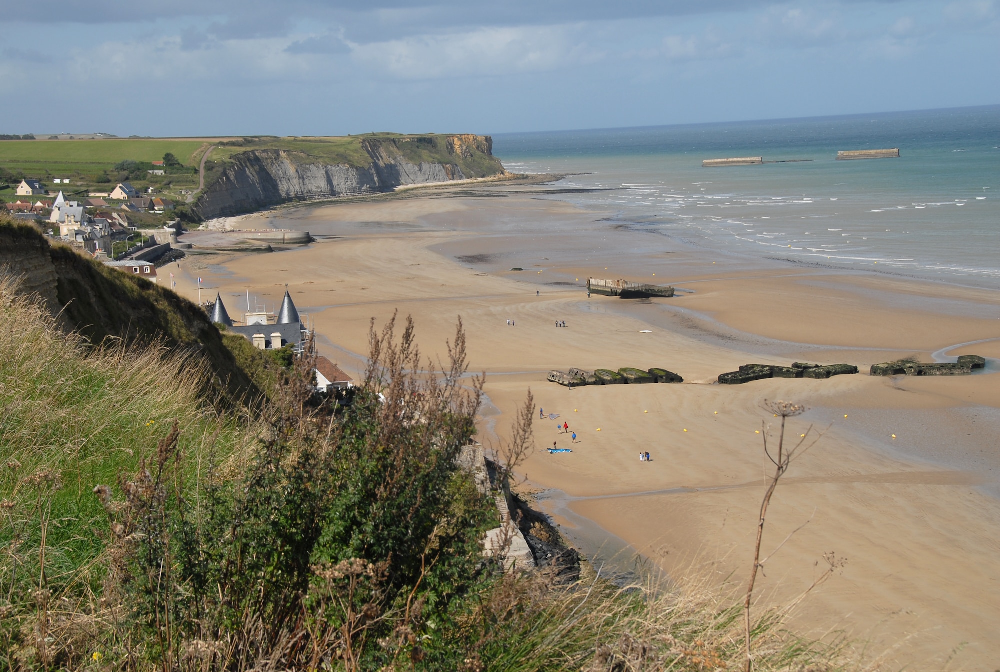 ARROMANCHES-LES-BAINS, France -- Views from the cliffs at Arromanches-les-Bains show beautiful blue-green water with the remains of the artificial Mulberry harbor, huge concrete blocks that make a ring in the water. This artificial harbor was used to off-load supplies for the allies during the D-Day invasion. (U.S. Air Force photo/Senior Master Sgt. Valerie J. Weaver)