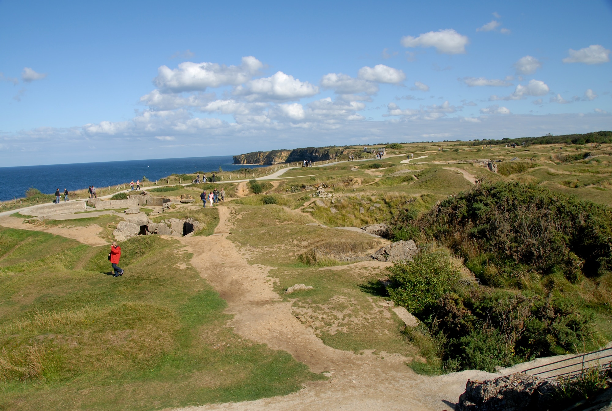 POINTE DU HOC, France -- The 2nd Ranger Battalion climbed the sheer, 100-foot cliffs to neutralize the German guns pounding Omaha and Utah Beaches on D-Day. The ground here is still pocked with holes from the bombers that pounded Pointe du Hoc to soften the target for the Rangers. Pillboxes that housed machine guns and bunkers still stand, and a few are broken pieces of concrete piles in the bombed holes in the ground. (U.S. Air Force photo/Senior Master Sgt. Valerie J. Weaver)