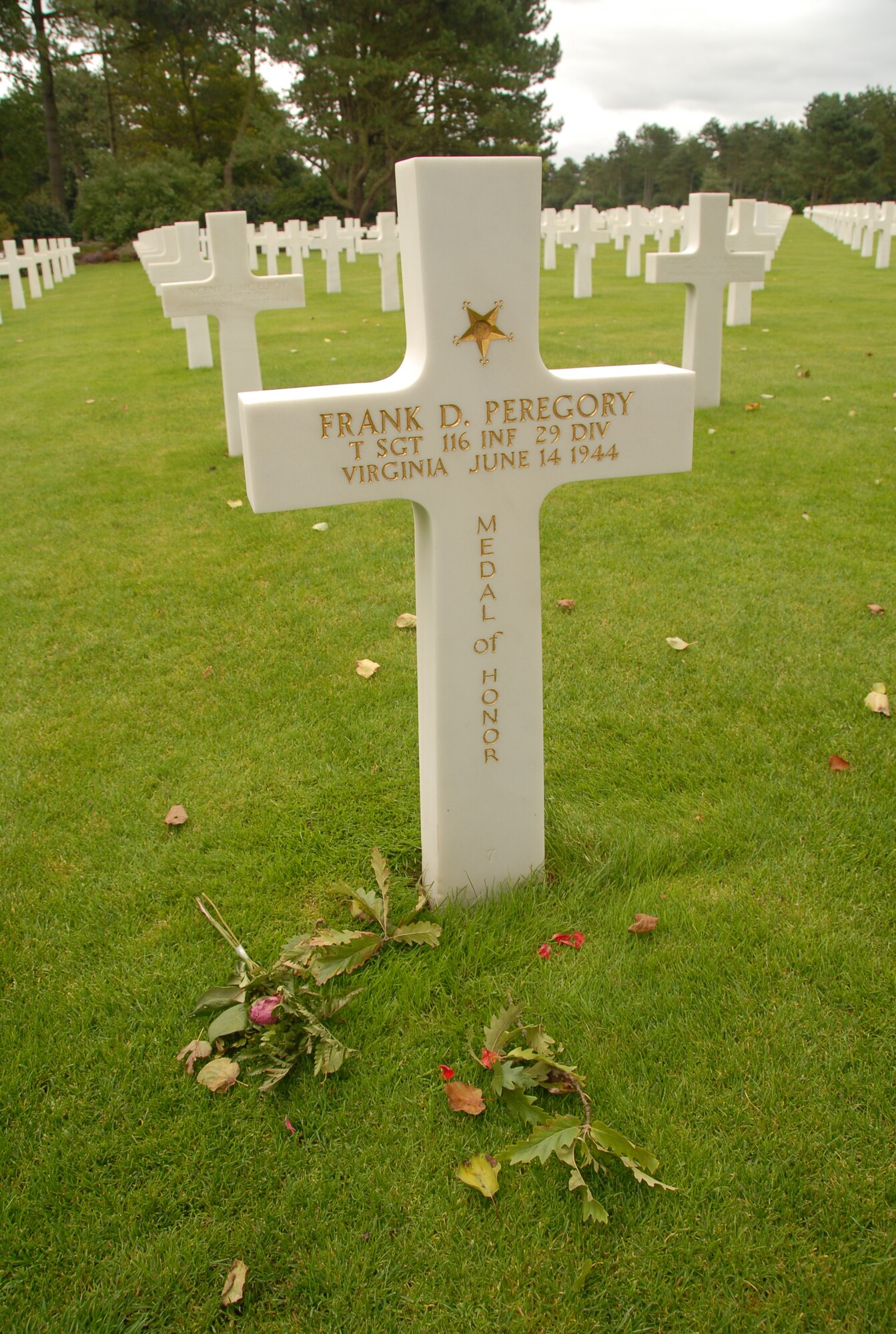 AMERICAN MILITARY CEMETERY, France -- The headstone of World War II Medal of Honor recipient Tech. Sgt. Frank D. Peregory stands among others in the cemetery by Omaha Beach in Normandy. The lettering on headstones for Medal of Honor recipients is in gold to set them apart from others. (U.S. Air Force photo/Senior Master Sgt. Valerie J. Weaver)
