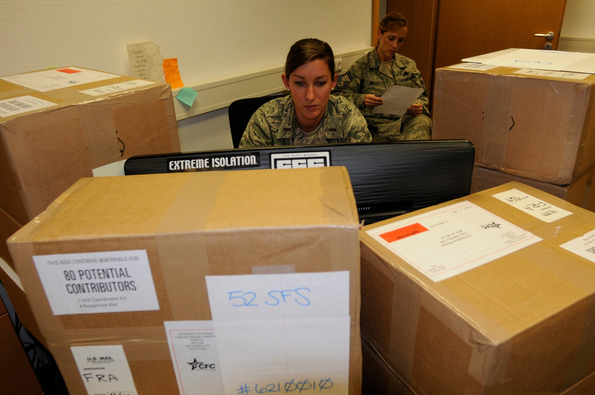 SPANGDAHLEM AIR BASE, Germany – Second Lt. Stephani Schafer, 52nd Fighter Wing Public Affairs deputy chief, front, and Senior Master Sgt. Renee Miller, 480th aircraft maintenance unit assistant superintendant, this year’s Combined Federal Campaign project officers, prepare for the 2011 CFC here Sep. 21. The CFC will run from Oct. 3 - Dec. 2. With more than 2,500 charities to choose from, the campaign allows service members and Department of Defense employees the opportunity to donate money to charities of their choice. (U.S. Air Force photo/Master Sgt. Kelley J. Stewart)