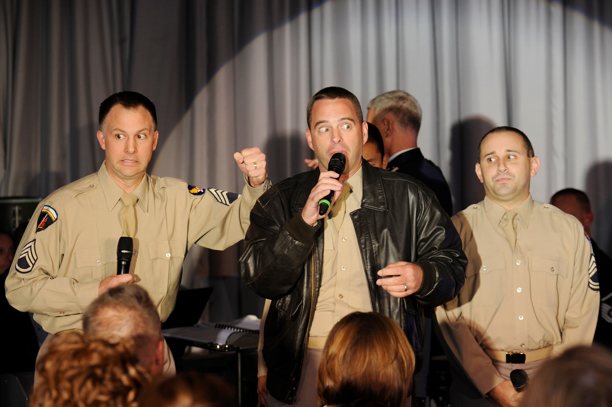 Master Sgt. Bradley Bennett , Master Sgt. Eric Sullivan, and Tech. Sgt. Joseph Haughton; U.S. Air Force Band’s Singing Sergeants, sing "Come On and Join the Air Force" in World War II era uniforms during the Air Force District of Washington Air Force Ball. The celebration was in honor of the Air Force’s 64th birthday, and included skits honoring World War II Airmen. (U.S. Air Force photo by Staff Sgt. Raymond Mills)