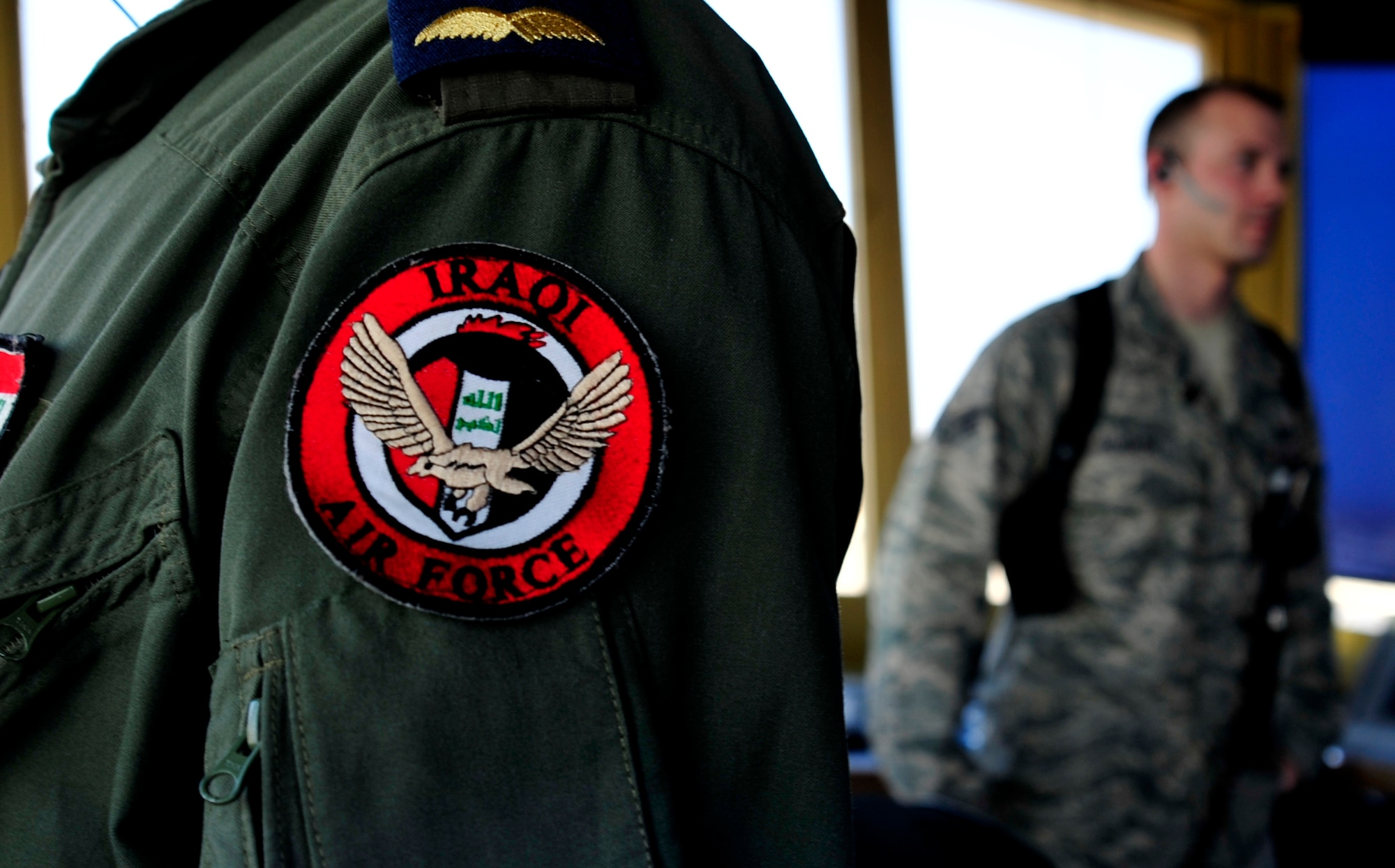 An Iraqi air traffic controller trains with U.S Airmen and contractors in the control tower at Ali Base, Iraq, Aug. 27, 2011. Iraqi air traffic controllers have been training for a year in preparation for the transition from U.S. to Iraqi control of air space. (U.S. Air Force photo/Master Sgt. Cecilio Ricardo)