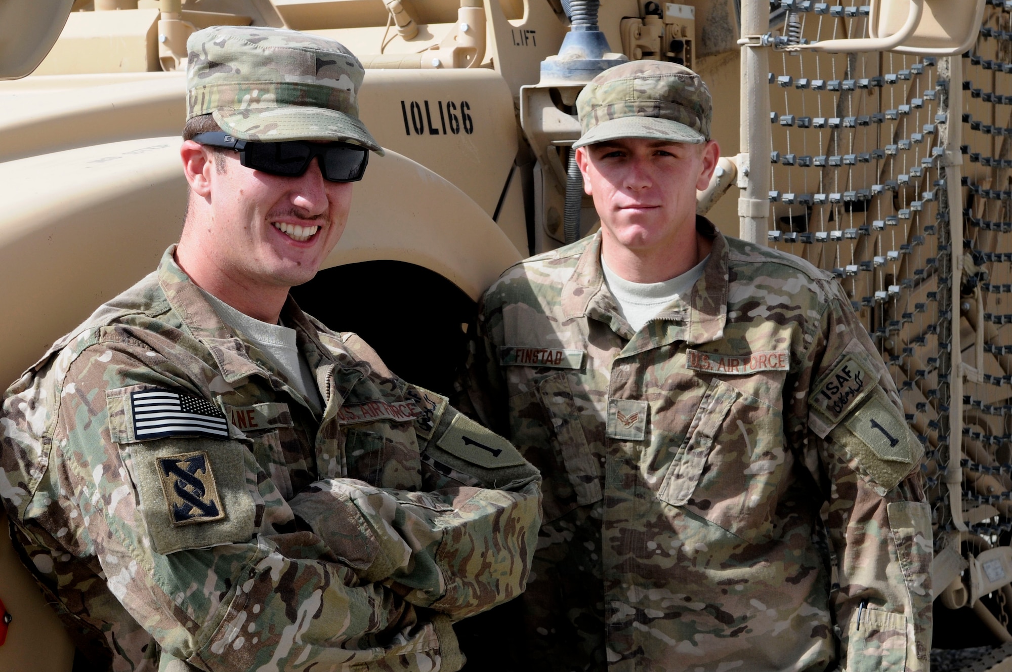 U.S. Air Force Senior Airmen Robert Lane, of San Antonio, and Robert Finstad, of Roosevelt, Ariz., both master drivers for Provincial Reconstruction Team Paktya, relax next to their trucks following a mission, Sept. 17, 2011. Both Lane and Finstad are deployed to Paktya Province, Afghanistan, in support of Operation Enduring Freedom. (U.S. Air Force photo/Senior Airman Wesley Farnsworth)