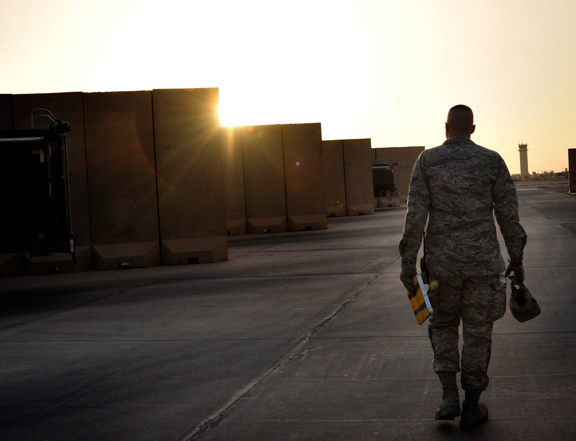 Airman 1st Class David Peterson, 407th Air Expeditionary Group fuels equipment specialist, prepares to refuel a Bell UH-1 Iroquois helicopter at Ali Base, Iraq, Aug. 24, 2011. He is deployed from Minot Air Force Base, N.D., and is from Tuscon, Ariz. (U. S. Air Force photo/Master Sgt. Cecilio Ricardo)