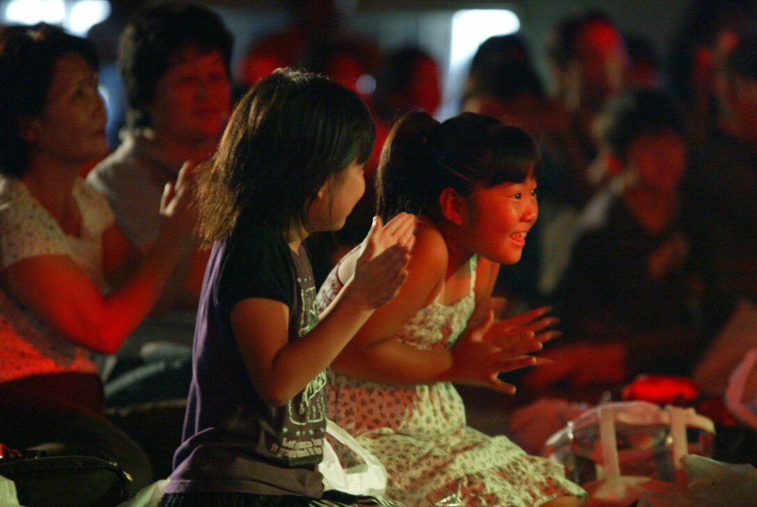 SENDAI, JAPAN--Audience members clap along in a gymnasium used as a temporary shelter immediately following the Great East Japan earthquake and tsunami.  Sep 2011.  (courtesy photo)